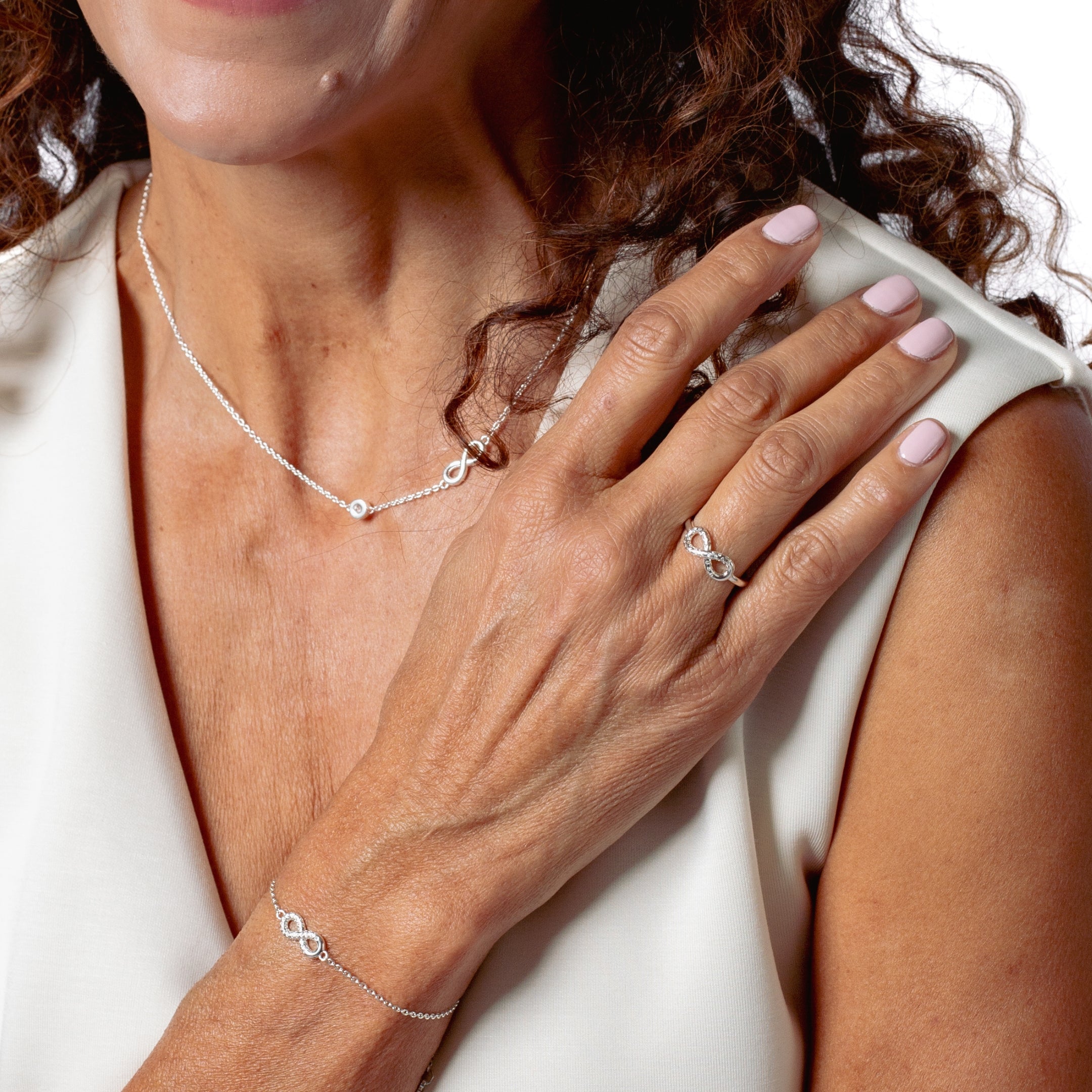 Sterling silver Infinite Hope Statement Ring showcases a pavé zirconia ichthys nestled within the infinity symbol by Rizen Jewelry pairs beautifully with the matching bracelet and necklace.