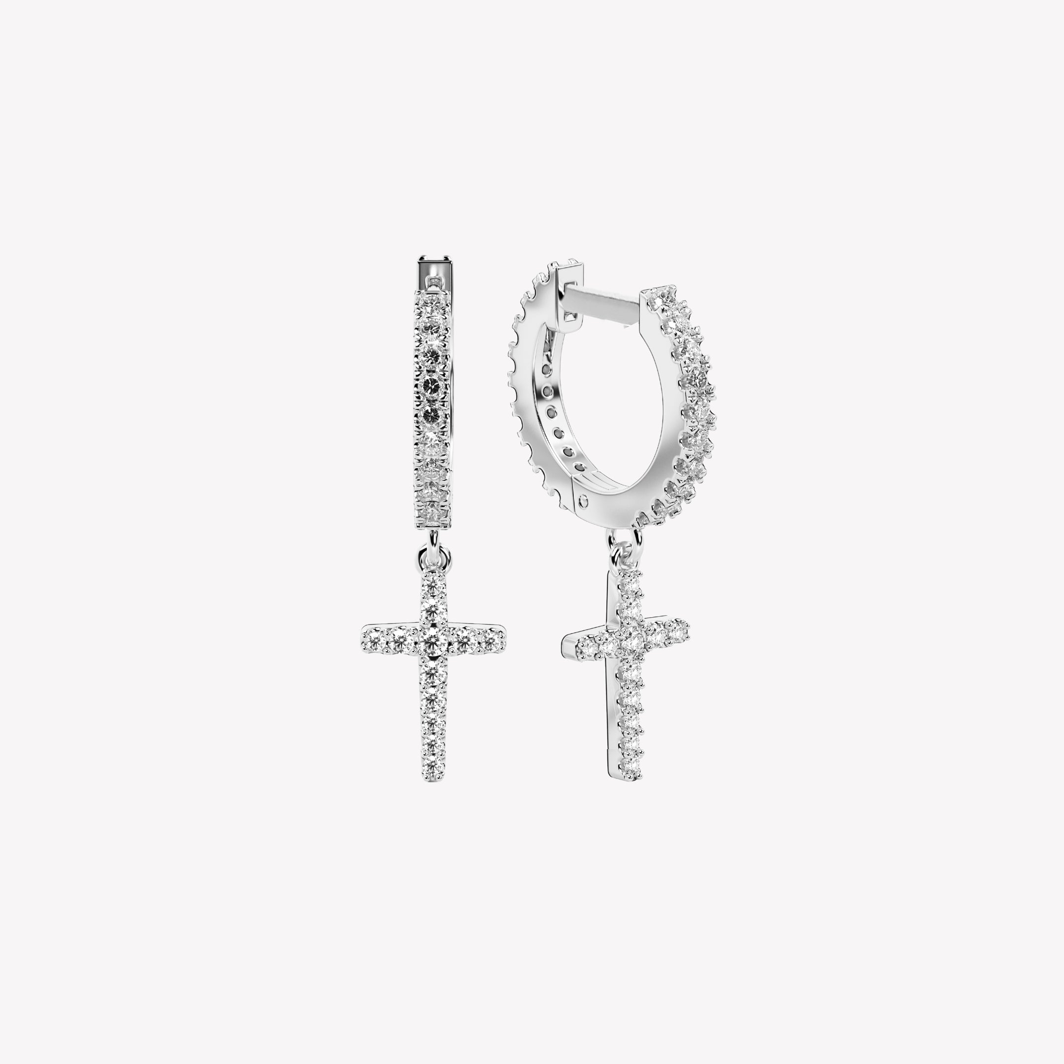 Sterling silver hoop earrings featuring delicate pointed cross charms. These sleek huggie hoops are paved with 24 micro-set zirconias throughout. Comfortable hinge closure. From the Calvary Collection by Rizen Jewelry.