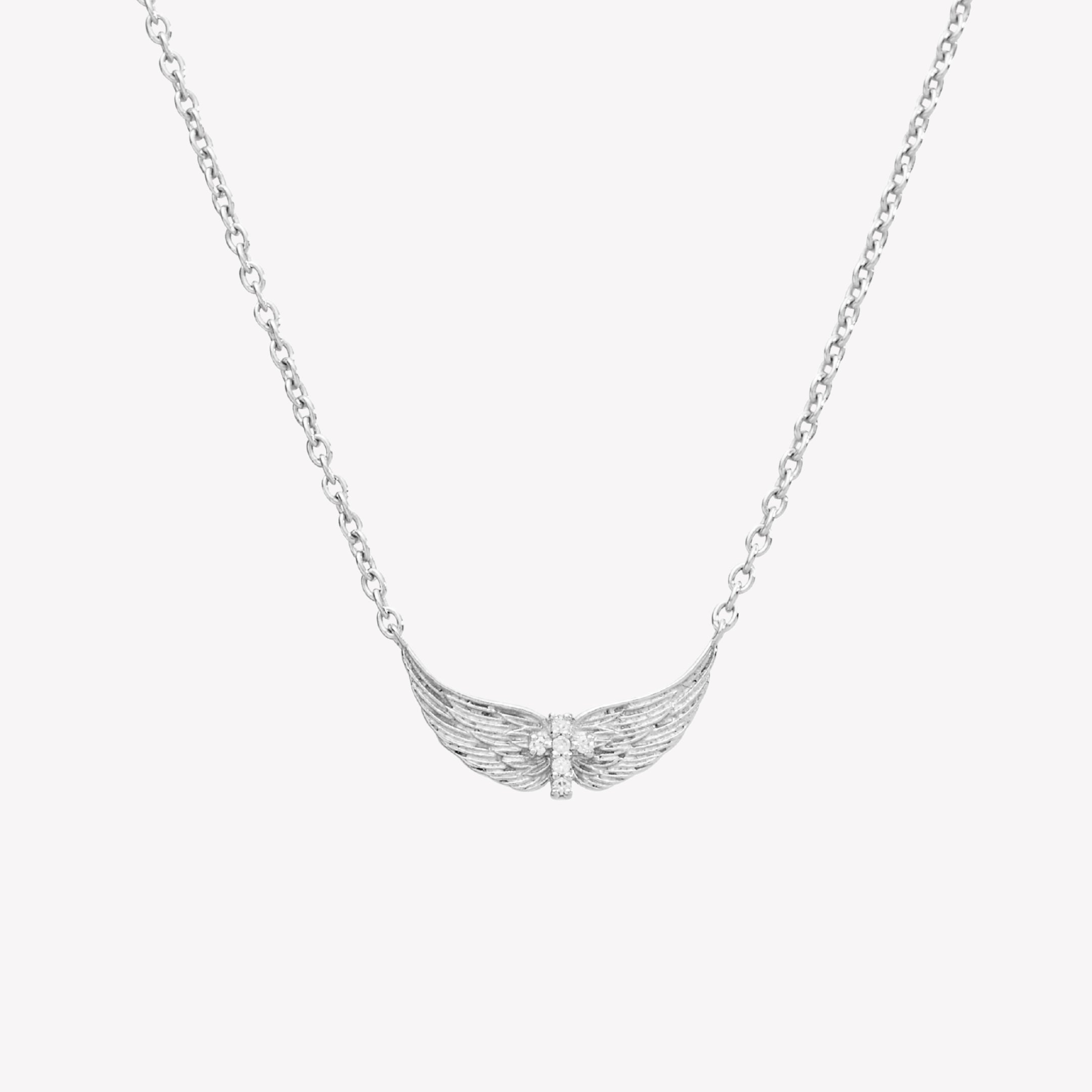 Sterling silver necklace featuring uplifted angel wings with a radiant cubic zirconia cross at the center and textured feather detail. Set on an adjustable 19.5 in cable chain.