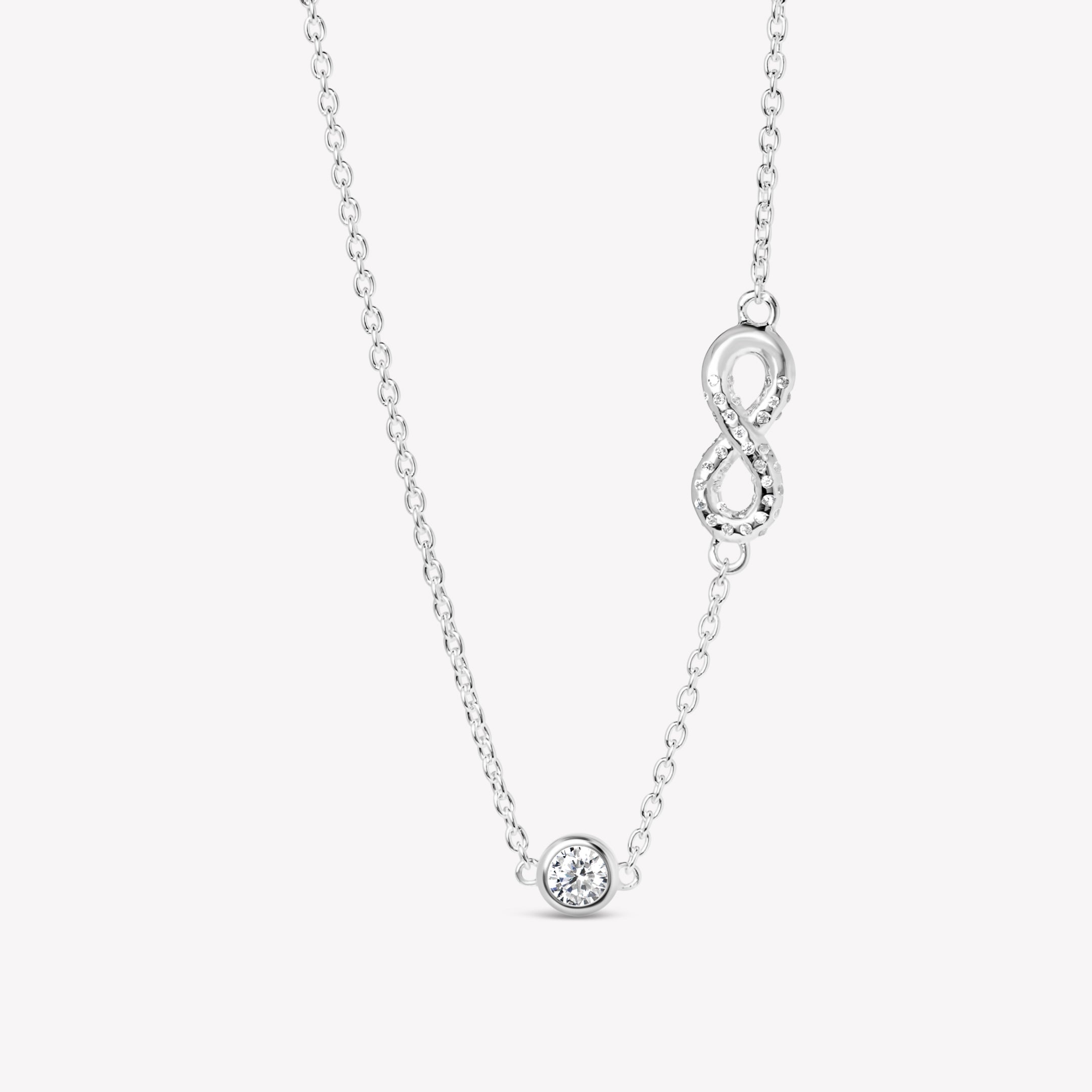 radiant sterling silver  Infinite Hope necklace showcases a pavé zirconia ichthys nestled within an infinity pendant, elegantly crowned by a 5mm solitaire centerpiece