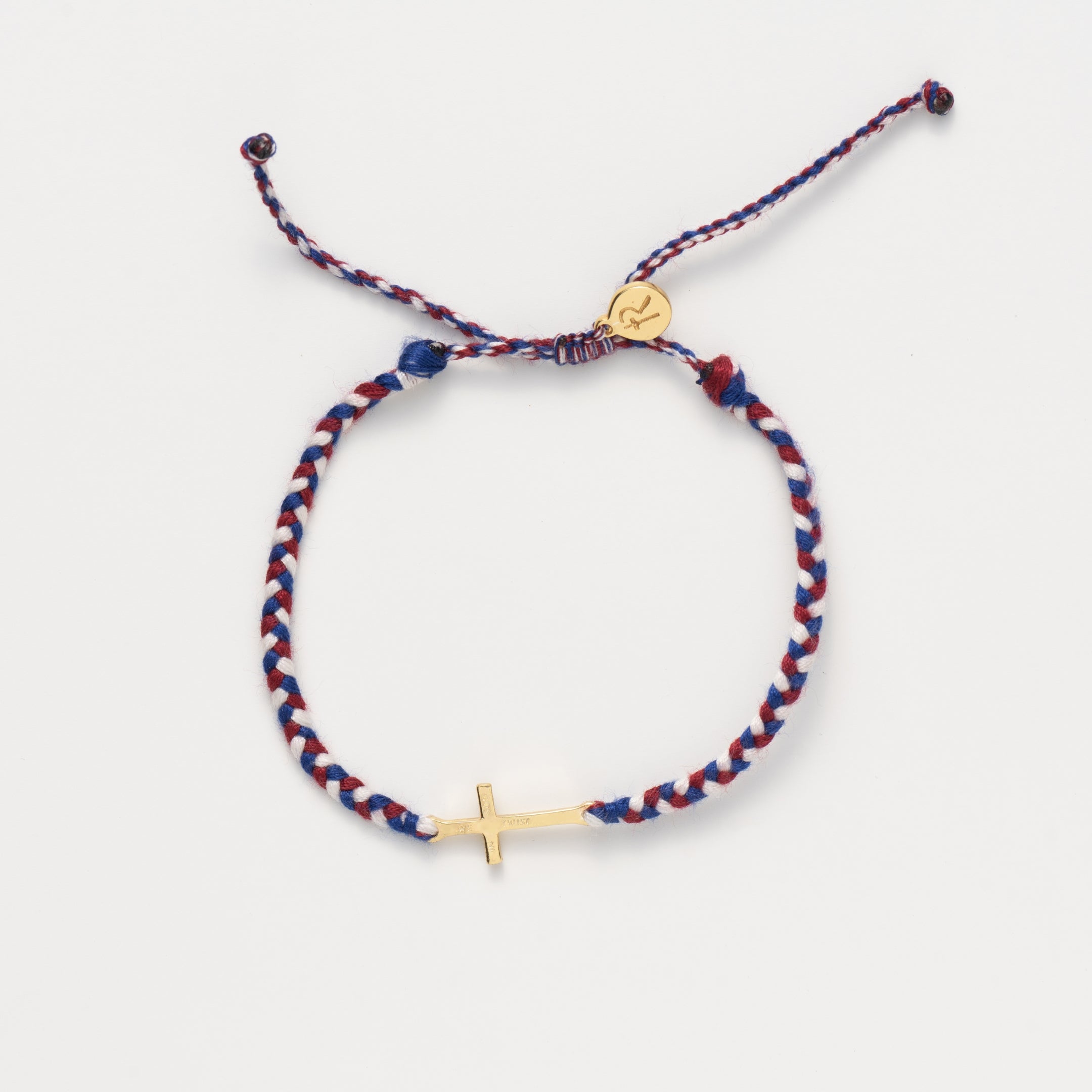 We Trust In God gold cross bracelet hand braided in red, white, blue cotton cord from Made4Ministry Collection by Rizen Jewelry