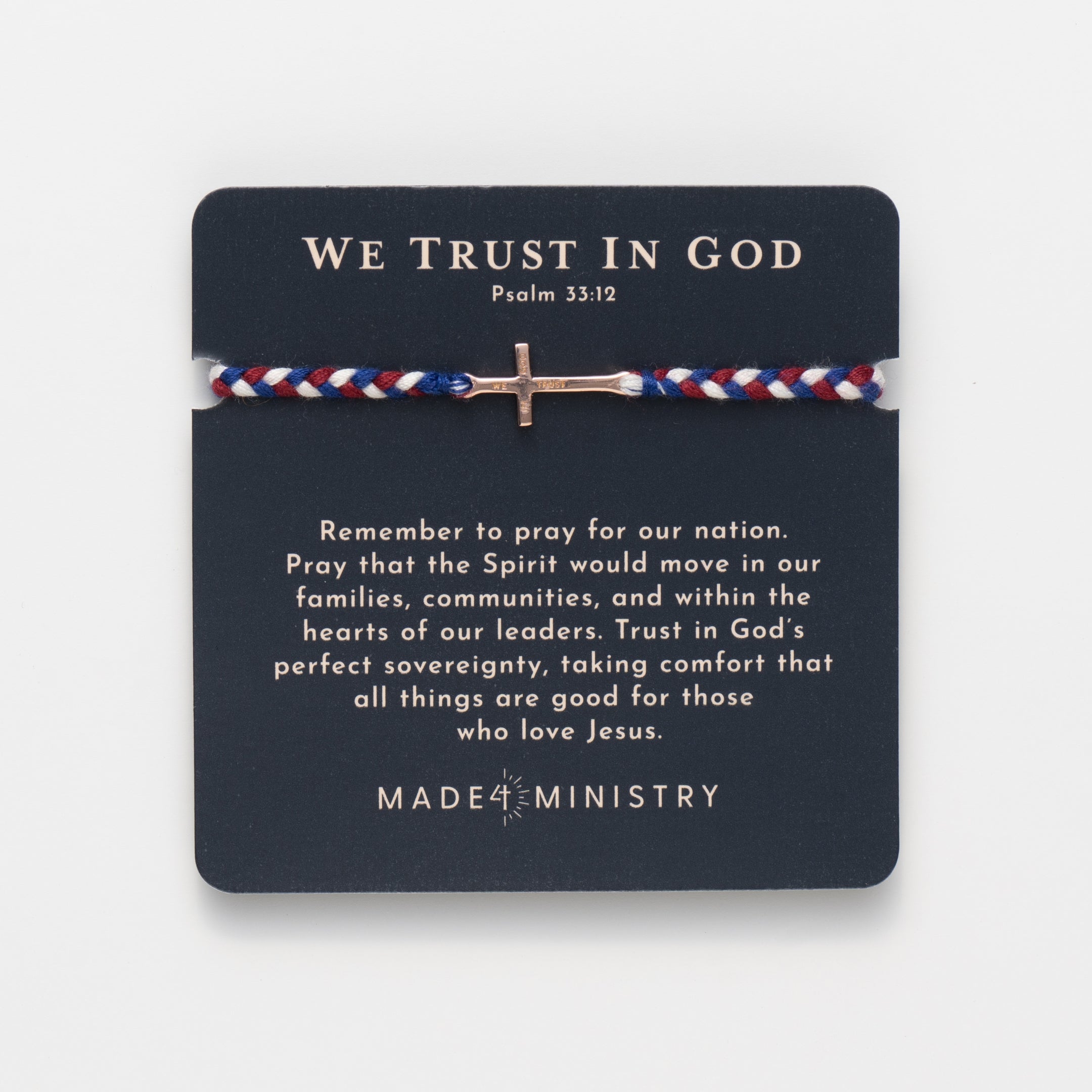 We Trust In God rose gold cross bracelet hand braided in red, white, blue cotton cord featured on keepsake devotion and prayer card from Made4Ministry Collection by Rizen Jewelry
