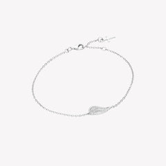 Sterling silver bracelet showcases a captivating single wing motif, elegantly outlined with sparkling cubic zirconia accents set on a cable chain with a cross tag pendant from the Insignia Collection by Rizen Jewelry.