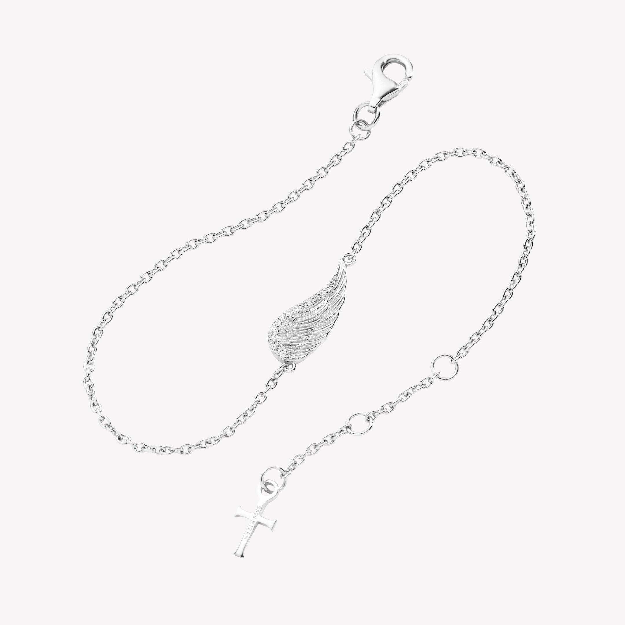 Sterling silver bracelet showcases a captivating single wing motif, elegantly outlined with sparkling cubic zirconia accents set on a cable chain with a cross tag pendant from the Insignia Collection by Rizen Jewelry.