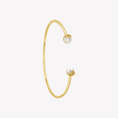Rizen Jewelry shell encased pearl bangle in gold vermeil from the Becoming Collection. 