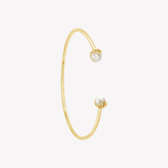 Rizen Jewelry shell encased pearl bangle in gold vermeil from the Becoming Collection.