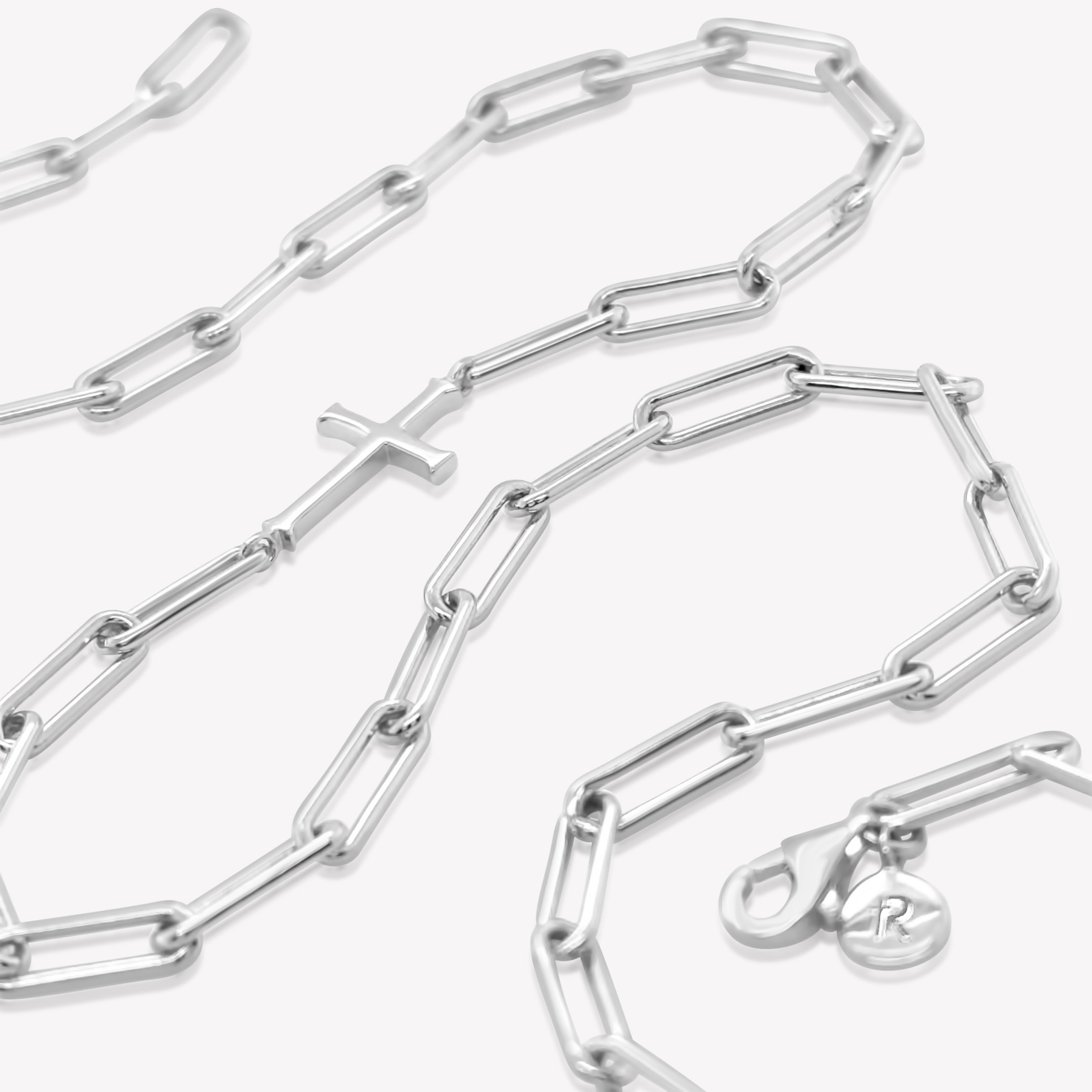 Rizen Jewelry Chain Breaker necklace in sterling silver.  Elegant Cross Pendant breaks up the paper clip link chain with classic lobster clasp  closure.