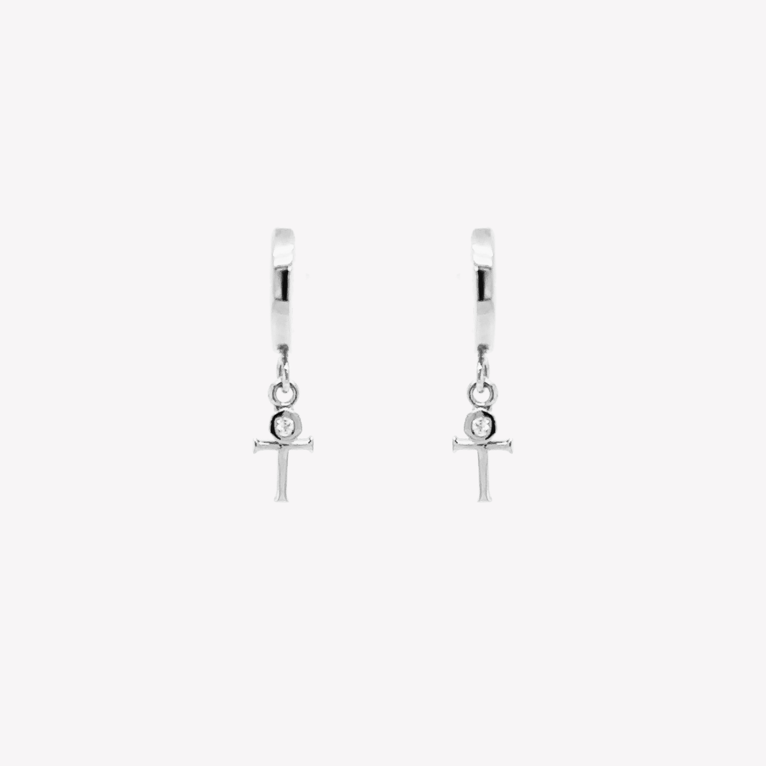 Rizen Jewelry sterling silver Cross Huggie Hoop Earrings with white topaz stone dangle from the Calvary Collection.