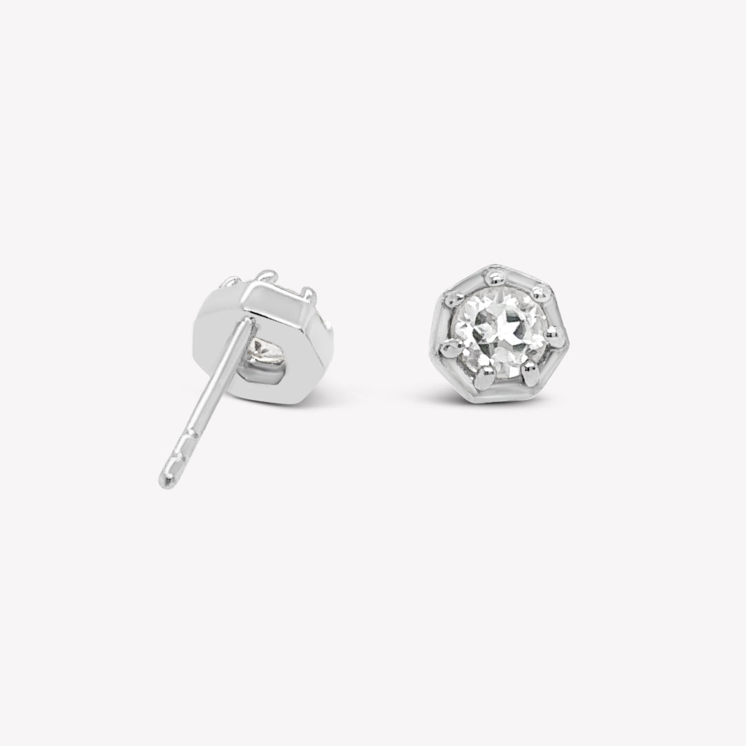 Rizen Jewelry Ebenezer solitaire white topaz earring in gold vermeil set in 7 prongs in a heptagon setting from the Chispa Collection.