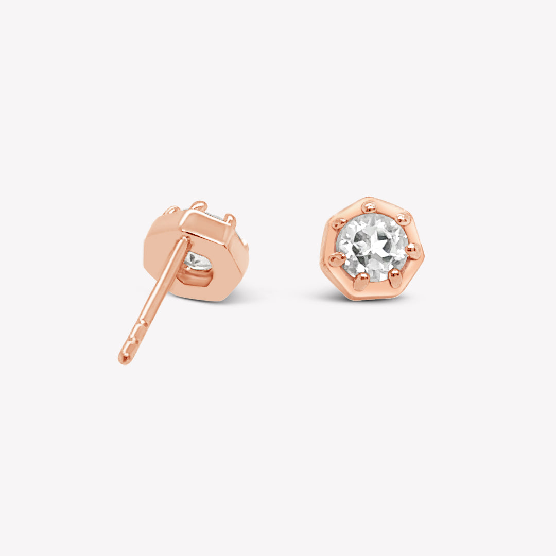 Rizen Jewelry Ebenezer solitaire white topaz earring in rose gold vermeil set in 7 prongs in a heptagon setting from the Chispa Collection.