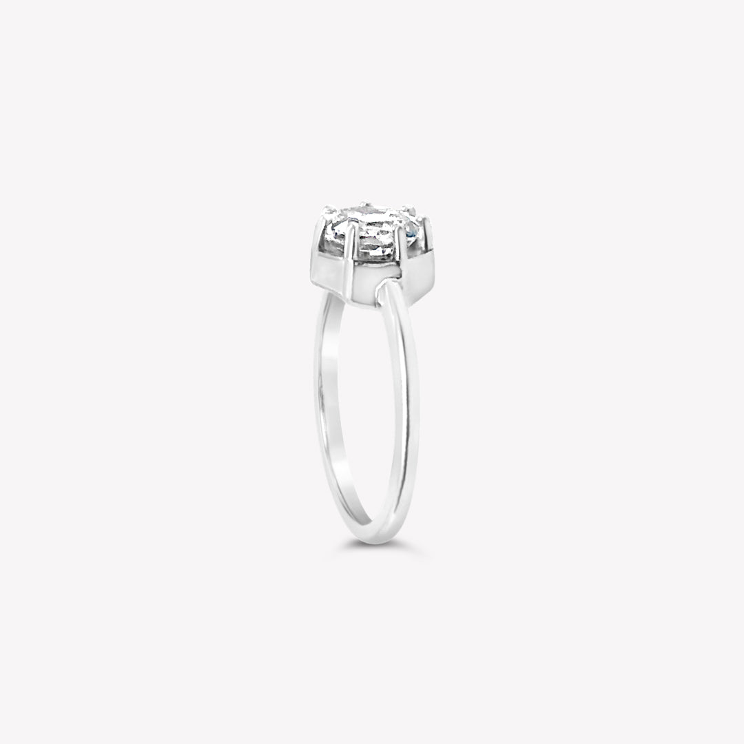 Rizen Jewelry Ebenezer Solitaire white topaz ring set with 7 prongs in sterling silver from the Chispa Collection.