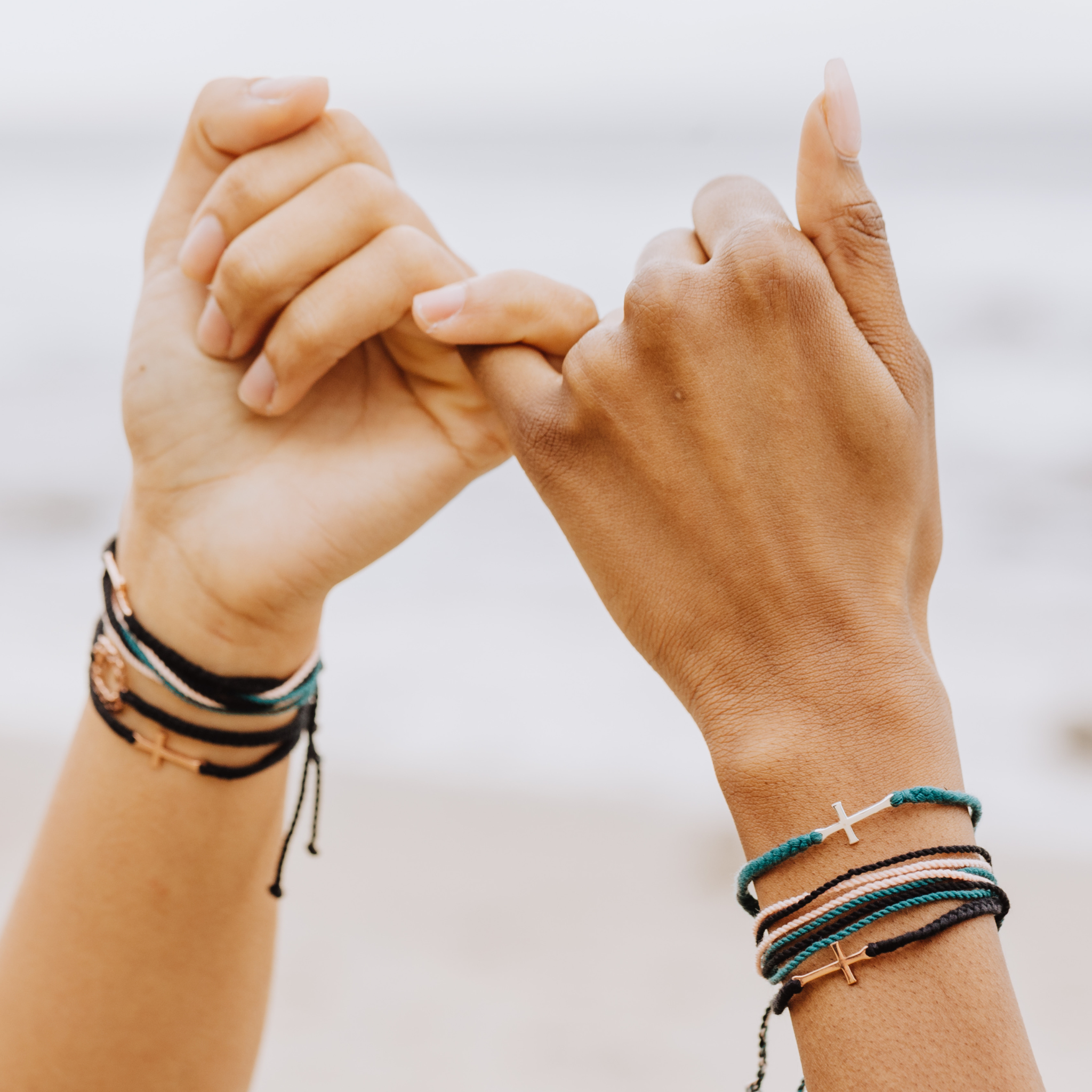 Rizen Jewelry best friends pink promise wearing Made4Ministry Christian Faith Inspired Cross Bracelets.