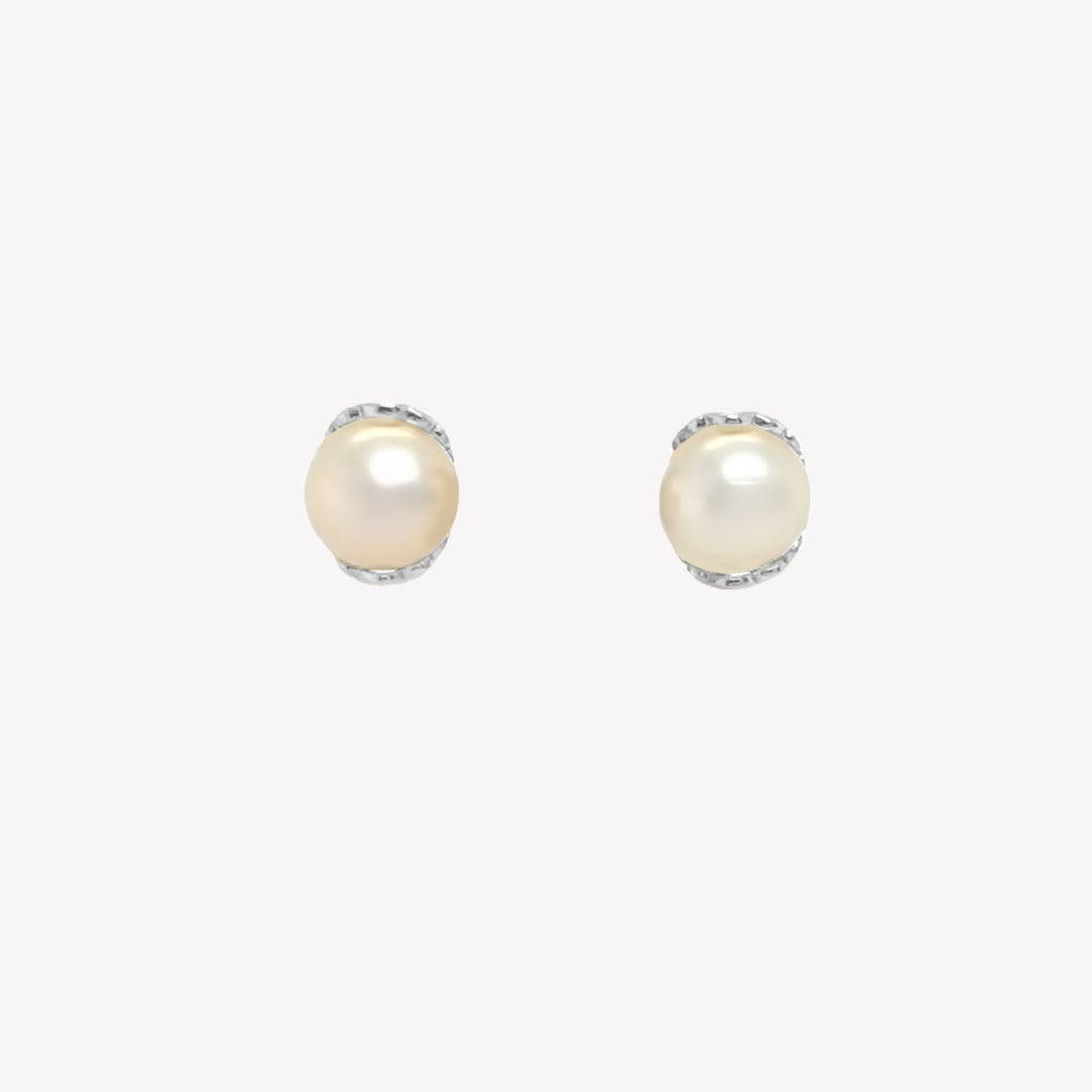 Rizen Jewelry shell encased pearl earring in sterling silver from the Becoming Collection.