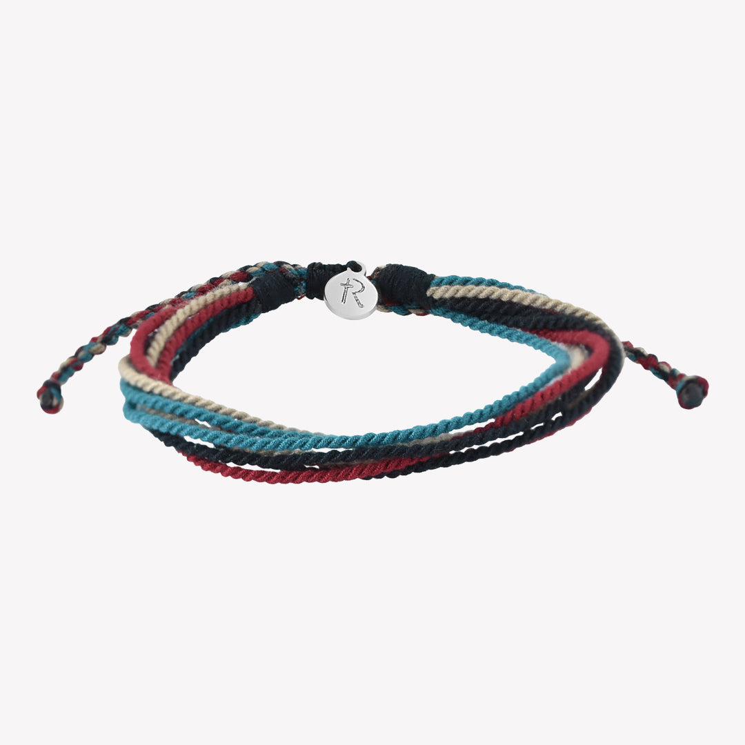 Rizen Jewelry Be Magnified Faithful multicord macrame bracelet. Cotton cords in black, garnet red, azure blue, and khaki with silver tag. Made 4 Ministries Collection. 