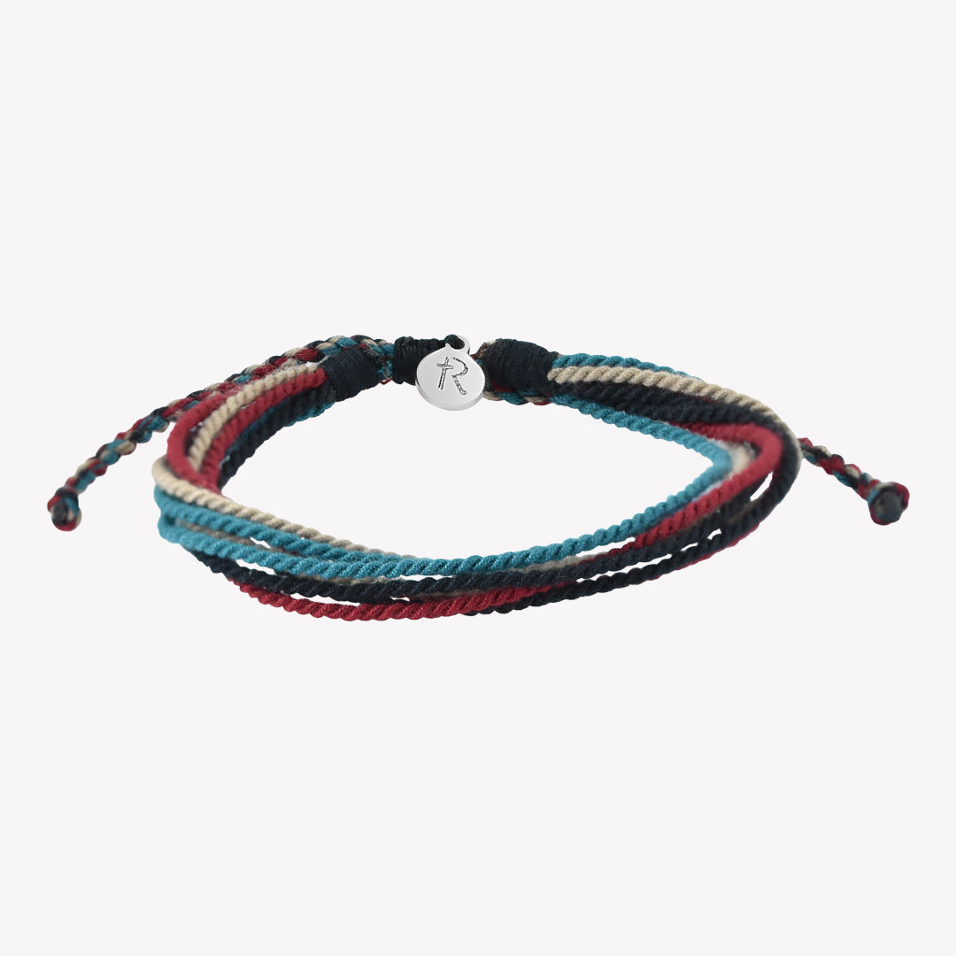 Rizen Jewelry Be Magnified Faithful multicord macrame bracelet. Cotton cords in black, garnet red, azure blue, and khaki with silver tag. Made 4 Ministries Collection.