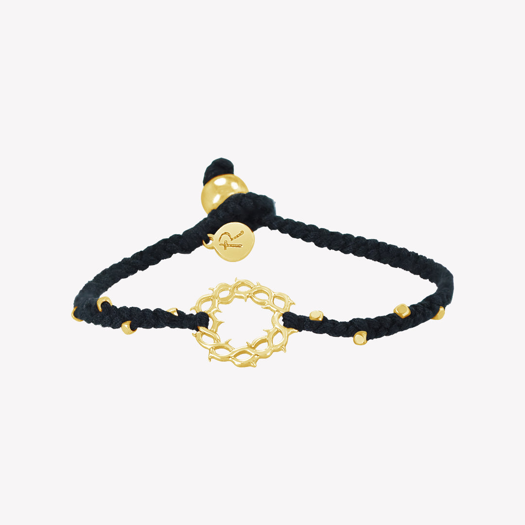 Faith inspired black braided friendship bracelet with gold crown of thorns pendant and 8 dainty beads with a pumpkin bead closure and a Rizen Jewelry Made 4 Ministries round tag.
