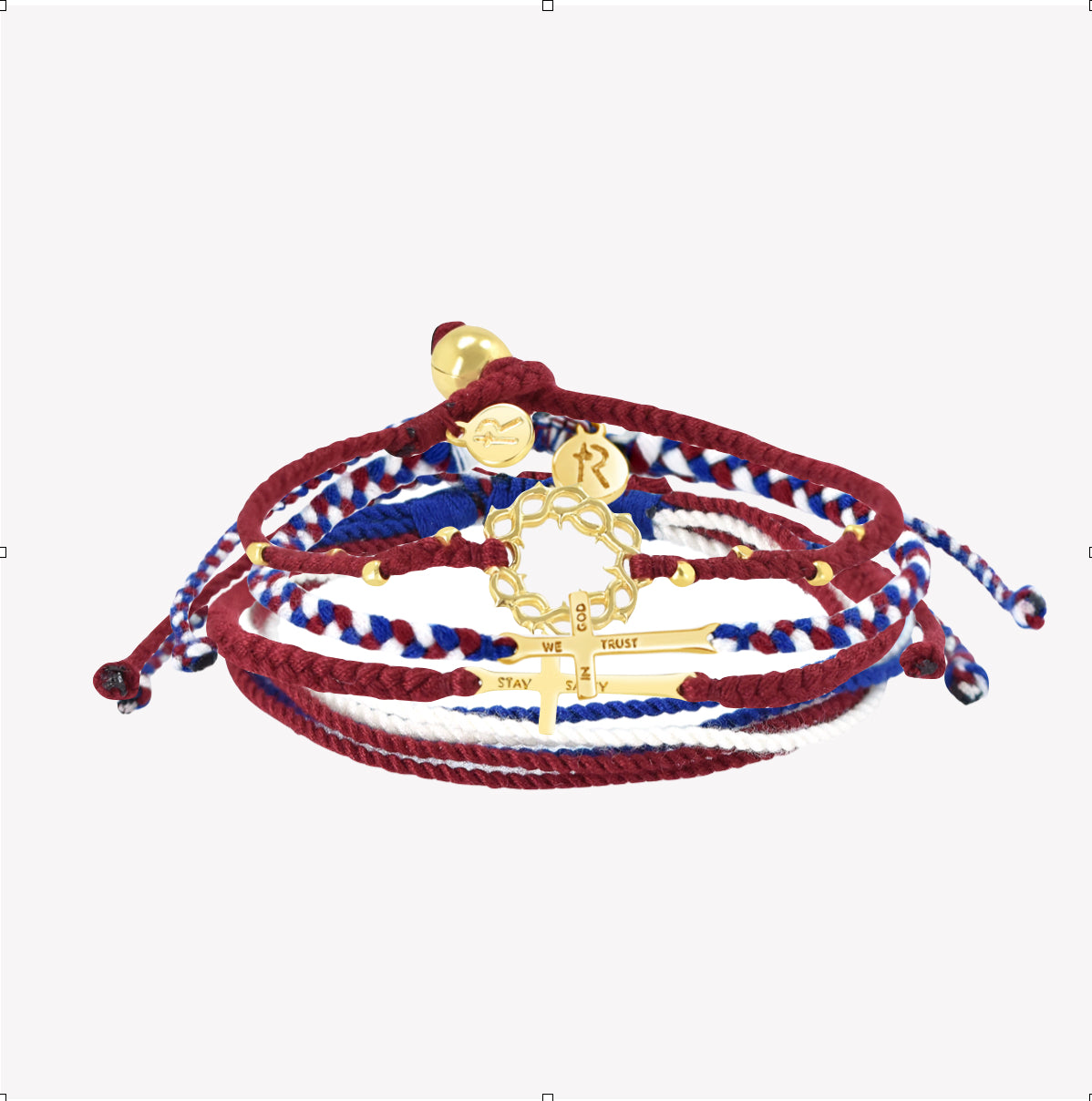 Rizen Jewelry Made 4 Ministries gold We Trust in God Bracelet Set. Featuring Red Garnet Beaded Crown of Thorns; Red, White, and Blue We Trust in God Cross bracelet; Garnet Red STAY SALTY braided bracelet; and peaceful Red, White, and Blue Be Magnified multi-cord bracelet.