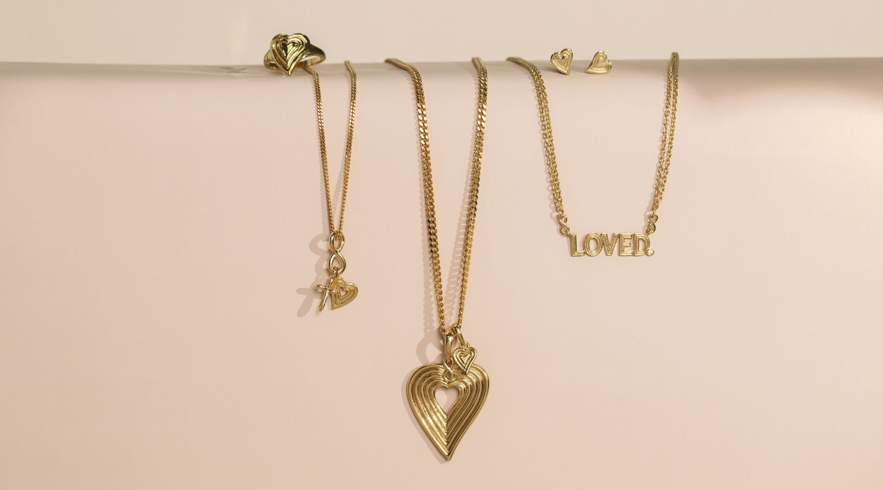Rizen Jewelry Infinite Hope Collection featuring sterling silver 18 carat plated jewelry: - faith hope love necklace - emanate love necklace - ring and earring - a loved necklace