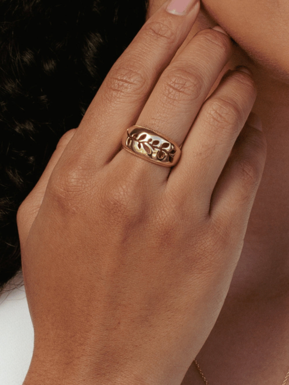Women's Christian jewelry model is wearing the Olive branch ring in 18k gold plated from the Rooted collection.   Inspirational gift for any occasion by Rizen Jewelry.