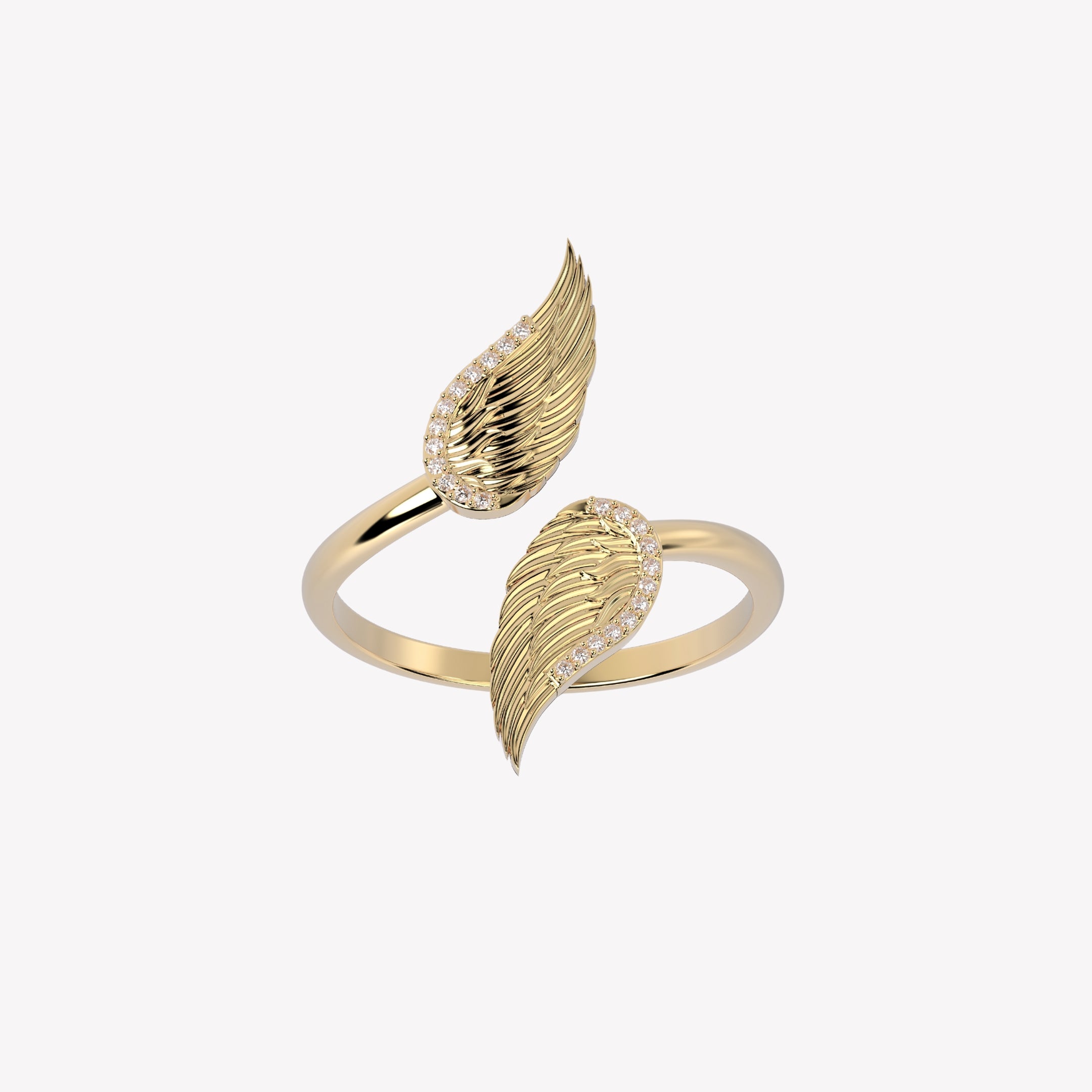 Captivating double angel wing motif ring, elegantly outlined with sparkling cubic zirconia accents. Crafted in 18k gold, generously plated over sterling silver.