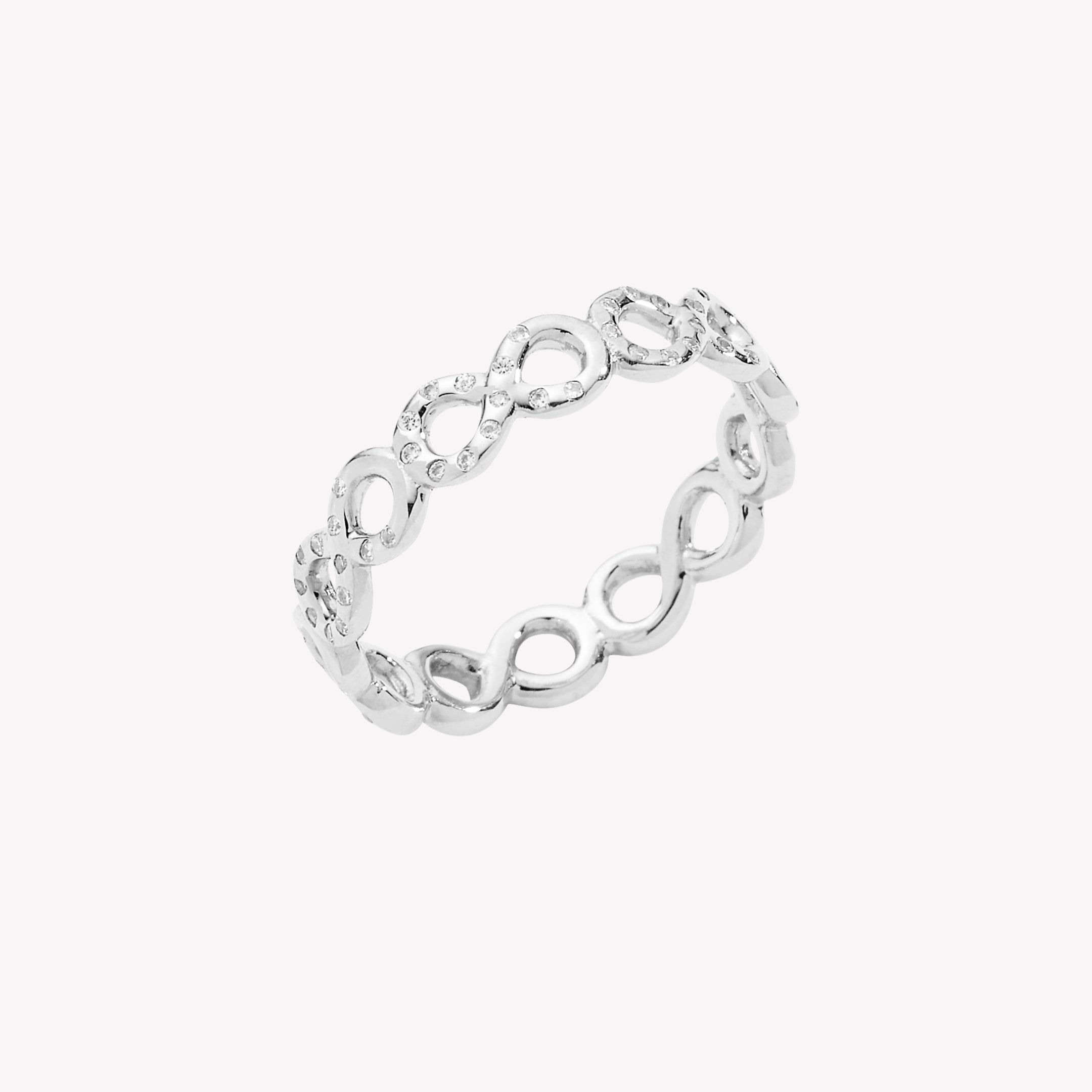 Sterling silver infinity band ring showcases a pavé zirconia ichthys nestled within each infinity loop from the Infinite Grace Collection by Rizen Jewelry. 