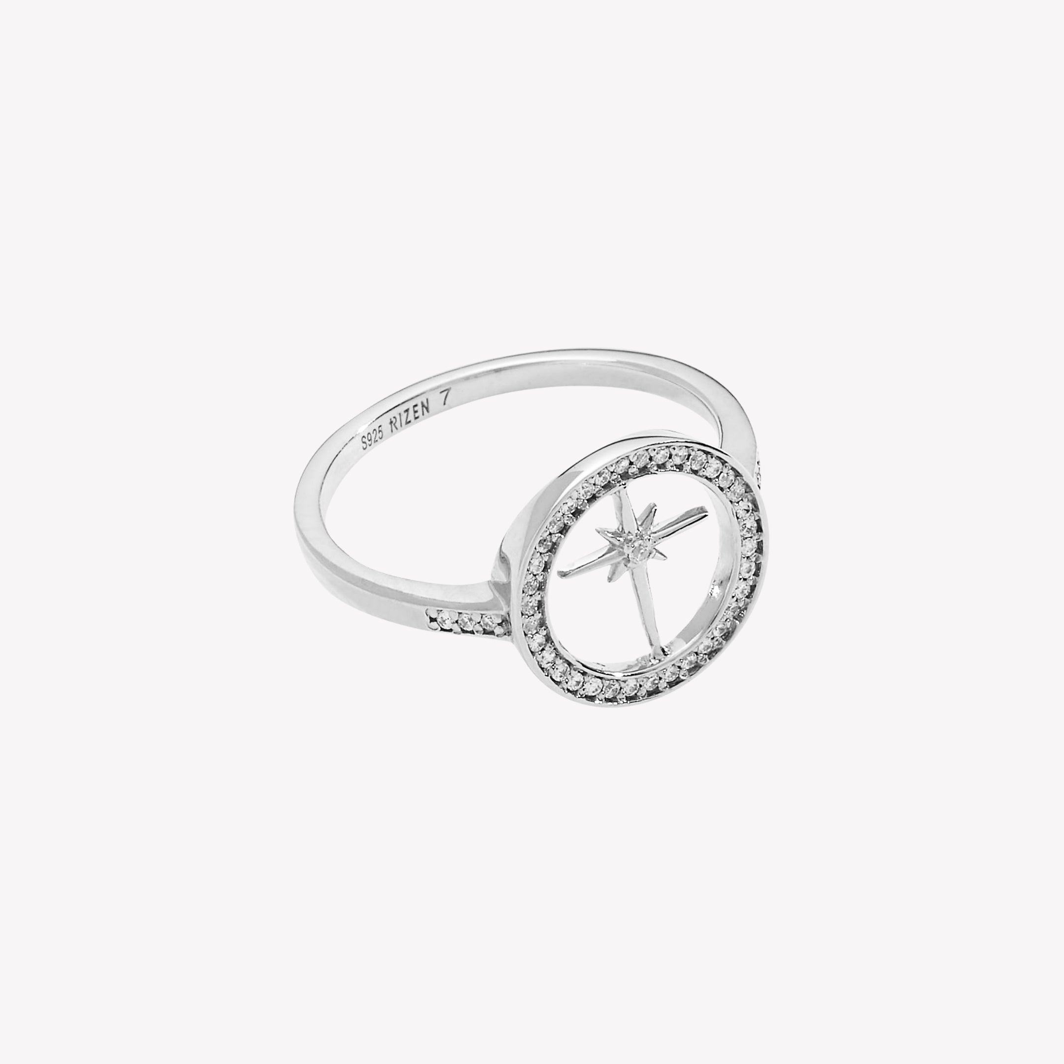 Sterling silver Adoring Star Compass Ring featuring 41 flush-set stones along the circular border and band from the Insignia Collection by Rizen Jewelry. 