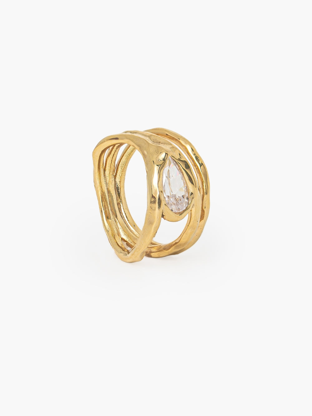 Rizen Jewelry Solace Teardrop Statement Ring has a tear-shaped simulated diamond framed within a hammer-textured setting, crafted with soft, reflective fluid curves. Sterling silver finished in 18k gold.