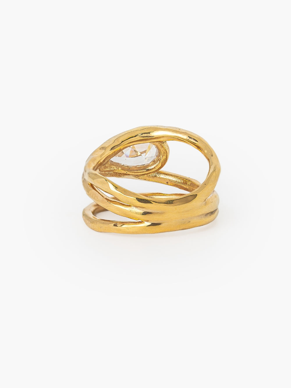Backwards view of the Rizen Jewelry Solace Teardrop Statement Ring that has a tear-shaped simulated diamond framed within a hammer-textured setting, crafted with soft, reflective fluid curves. Sterling silver finished in 18k gold.