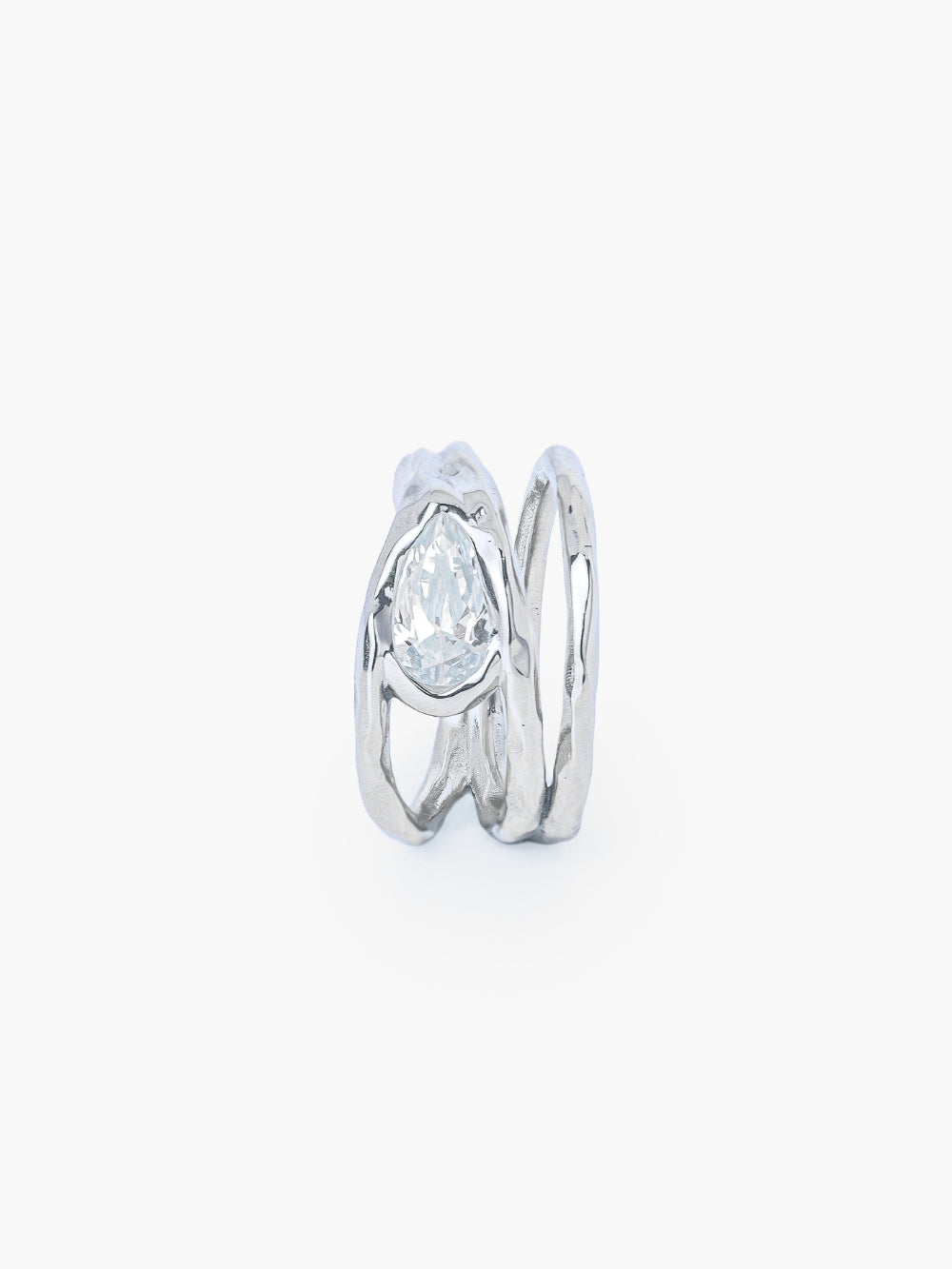 A tear-shaped simulated diamond ring framed within a hammer-textured setting, crafted with soft, reflective fluid curves. The Rizen Jewelry Solace Teardrop Statemnet Ring is crafted in sterling silver.