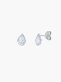 A pair of Rizen Jewelry Solace Tear Stud Earrings  in sterling silver stud.  They feature a tear drop shaped simulated diamond shown on a plain light gray background.