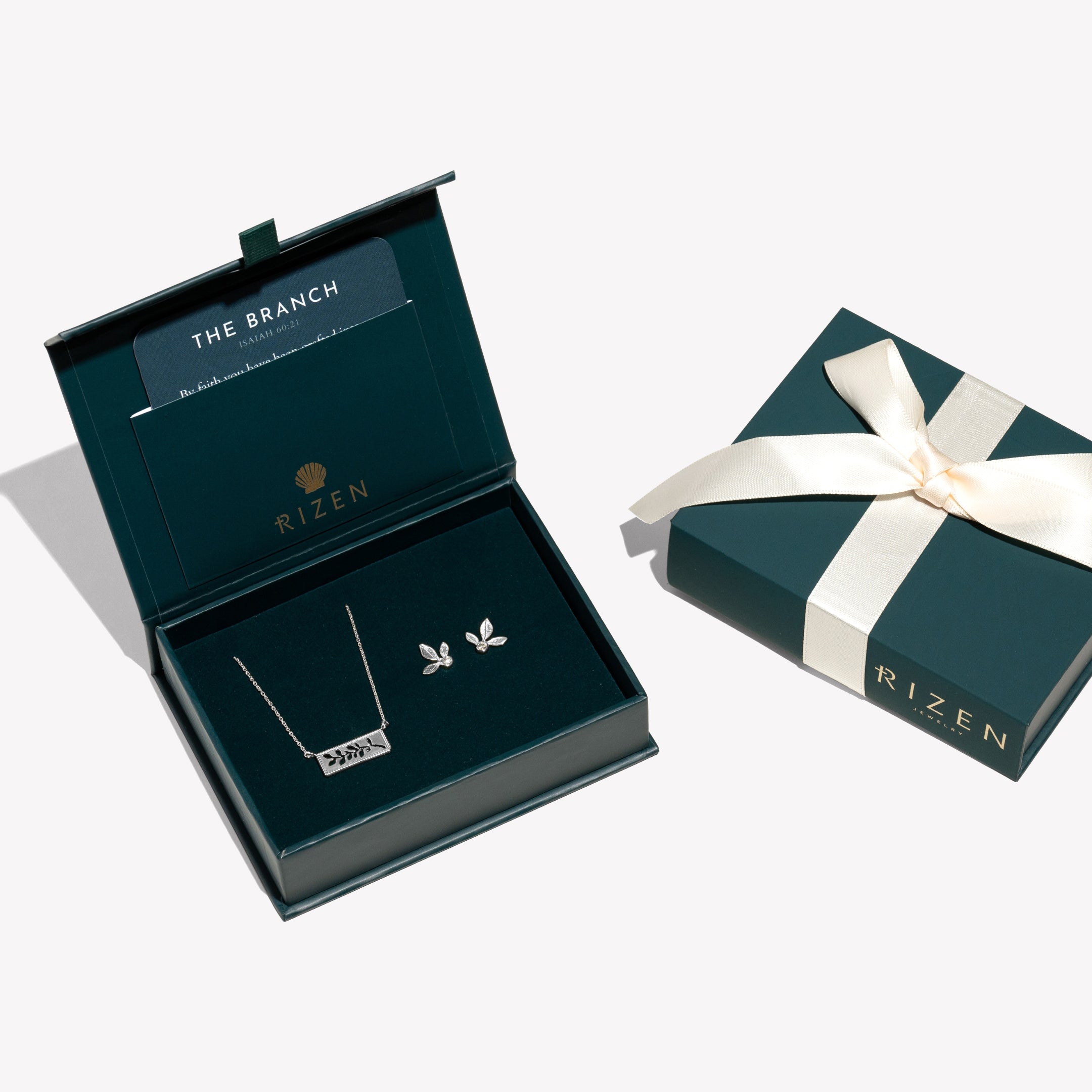 Serene Reverence Jewelry Set in sterling silver featuring the exquisite Olive Leaf Earrings and beautiful Branch Necklace  from the Rooted Collection ready to gift in the Rizen Jewelry signature packaging with keepsake devotion.  