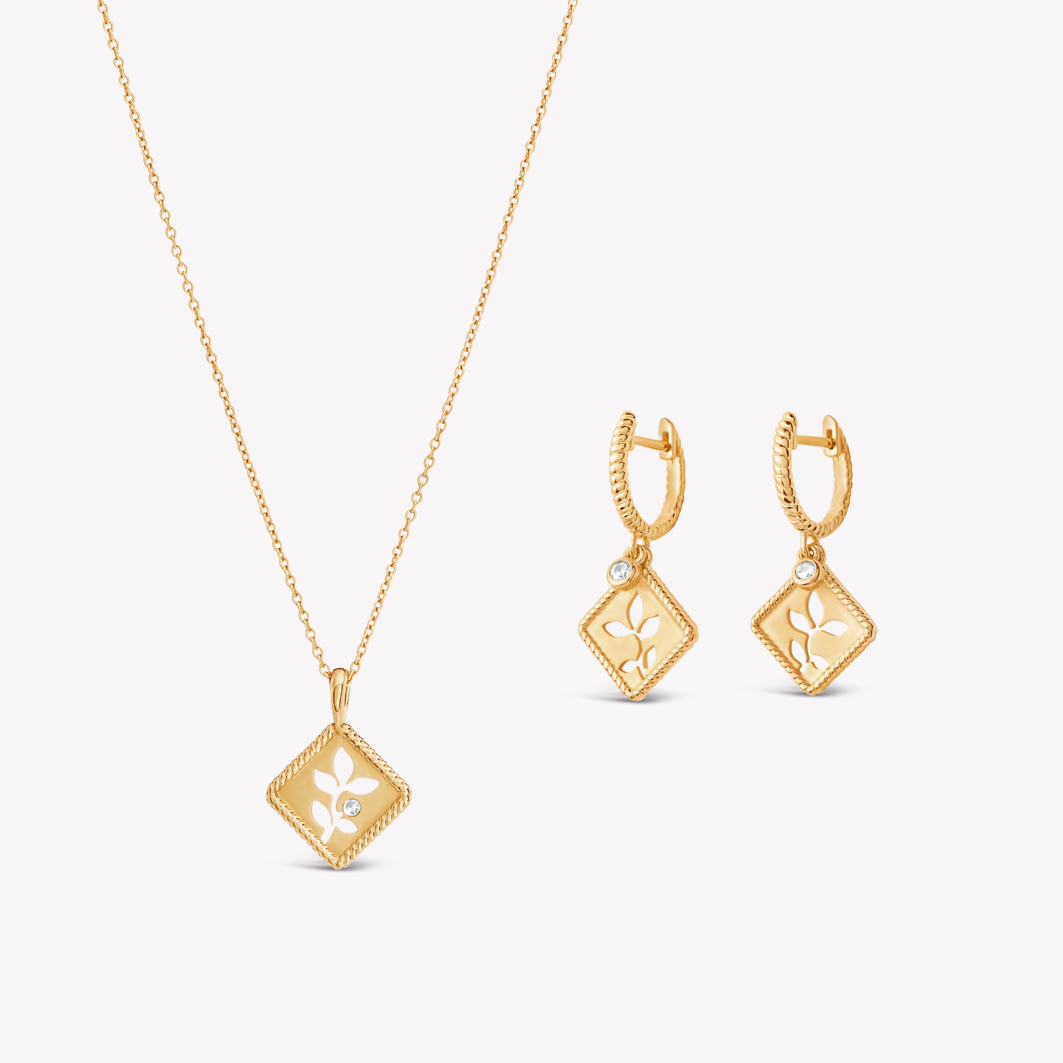 Peaceful Radiance Jewelry Set in 18k gold vermeil featuring the exquisite Olive Leaf Necklace and Hoop Earrings with subtle matte finish, intricate rope borders, and delicate cubic zirconias details from the Rooted Collection by Rizen Jewelry. 