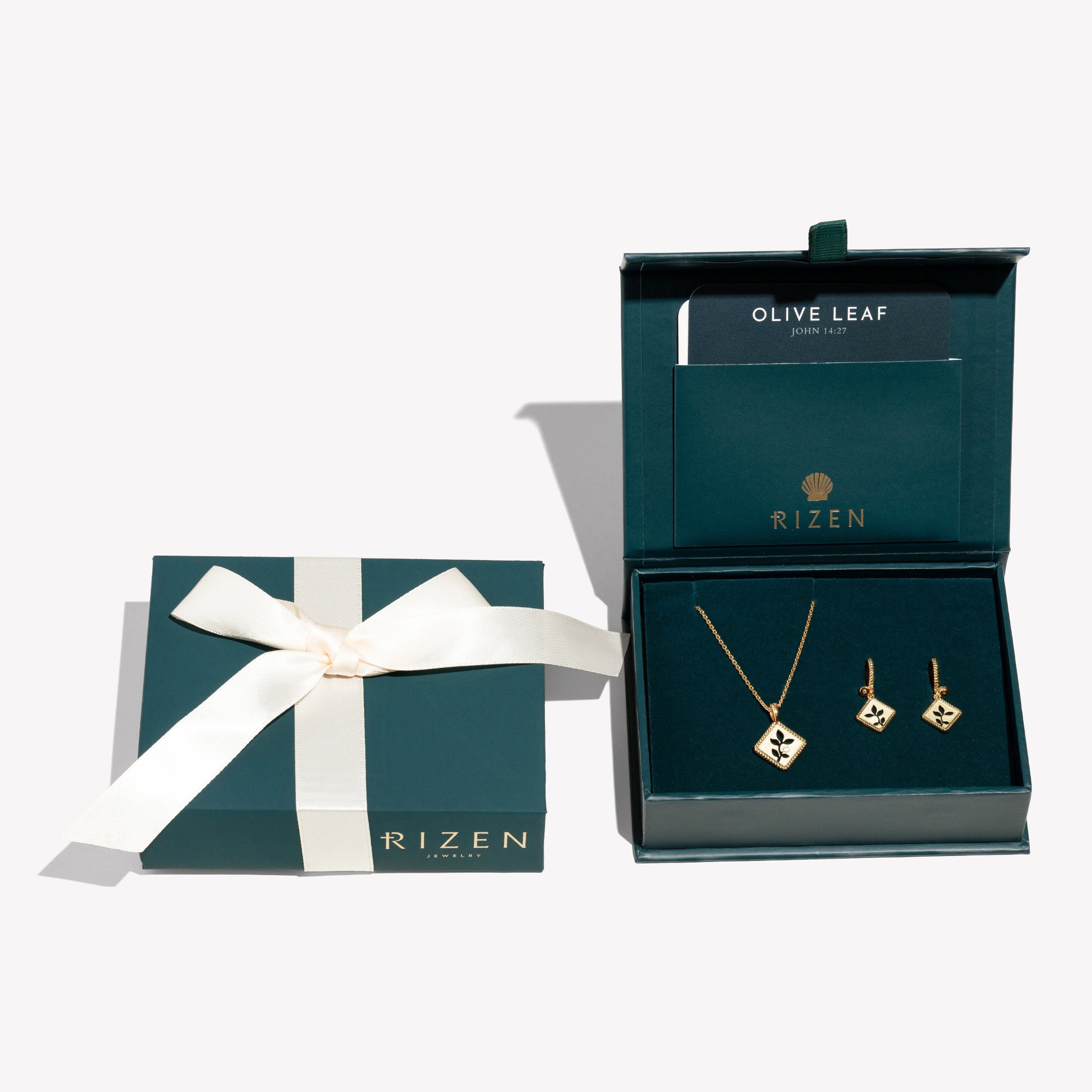 Peaceful Radiance Jewelry Set in 18k gold vermeil featuring the exquisite Olive Leaf Necklace and Hoop Earrings from the Rooted Collection ready to gift in the signature Rizen Jewelry packaging with keepsake devotion. 