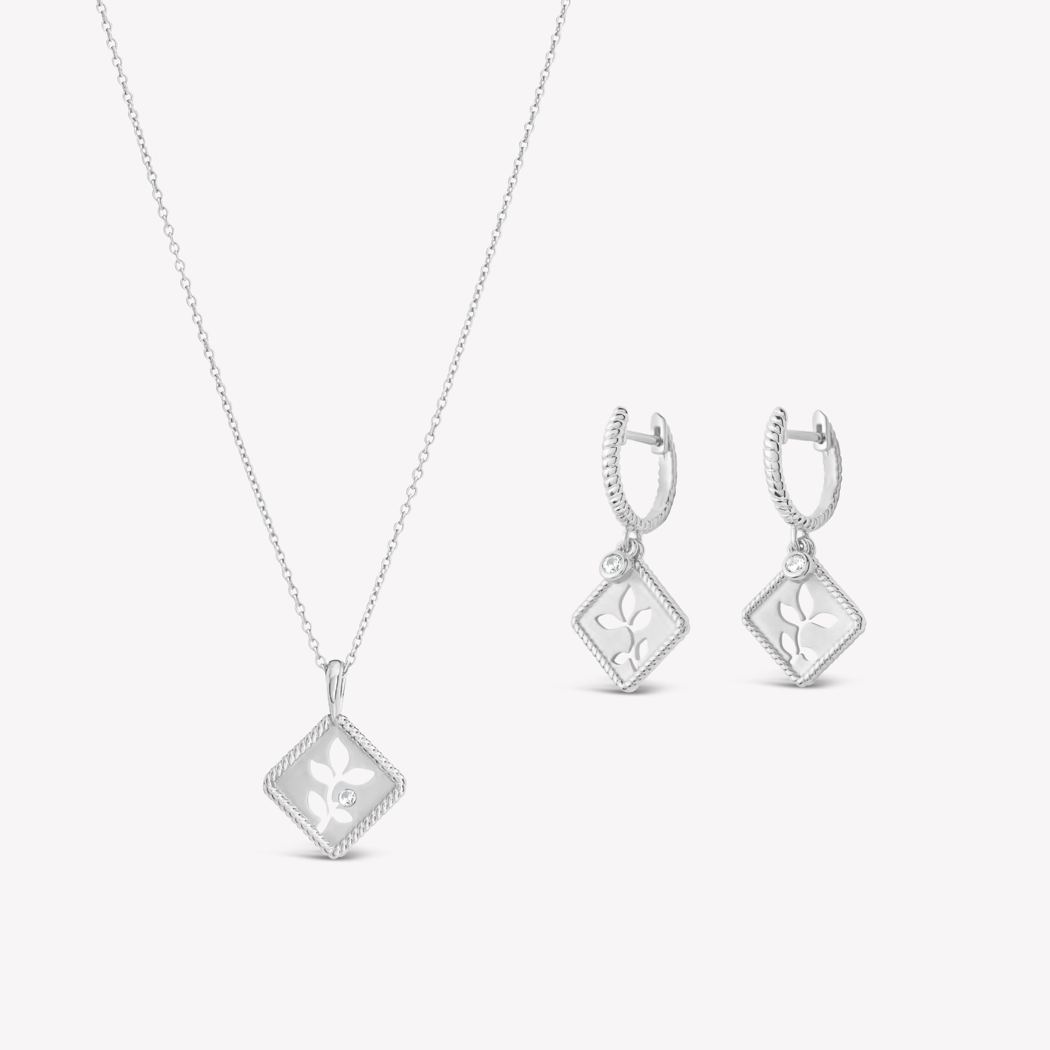 Peaceful Radiance Jewelry Set in sterling silver featuring the exquisite Olive Leaf Necklace and Hoop Earrings with details like a subtle matte finish, intricate rope borders, and delicate cubic zirconias  from the Rooted Collection by Rizen Jewelry. 