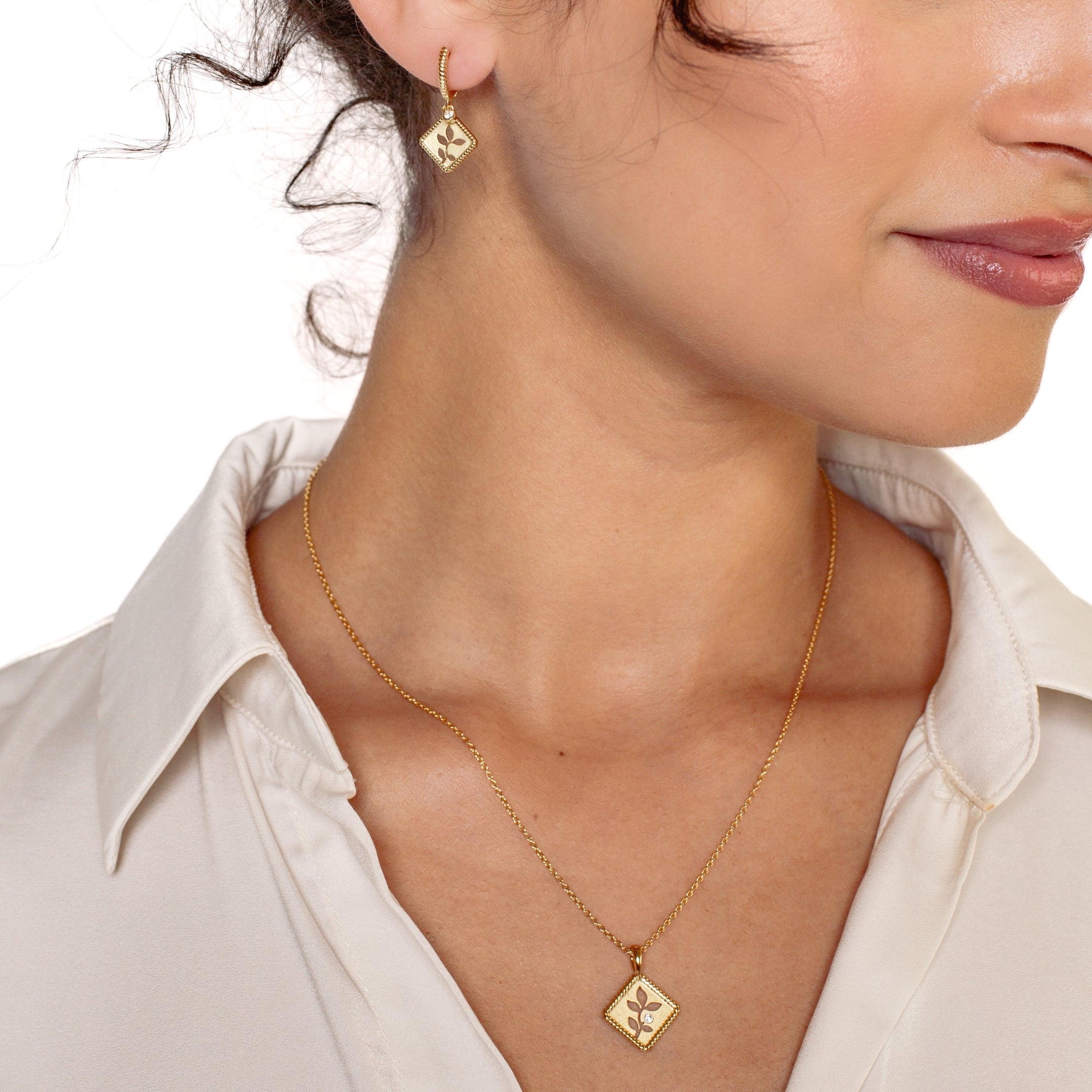 Peaceful Radiance Jewelry Set in 18k gold vermeil featuring the exquisite Olive Leaf Necklace and Hoop Earrings from the Rooted Collection worn by Rizen Jewelry christian female model.  