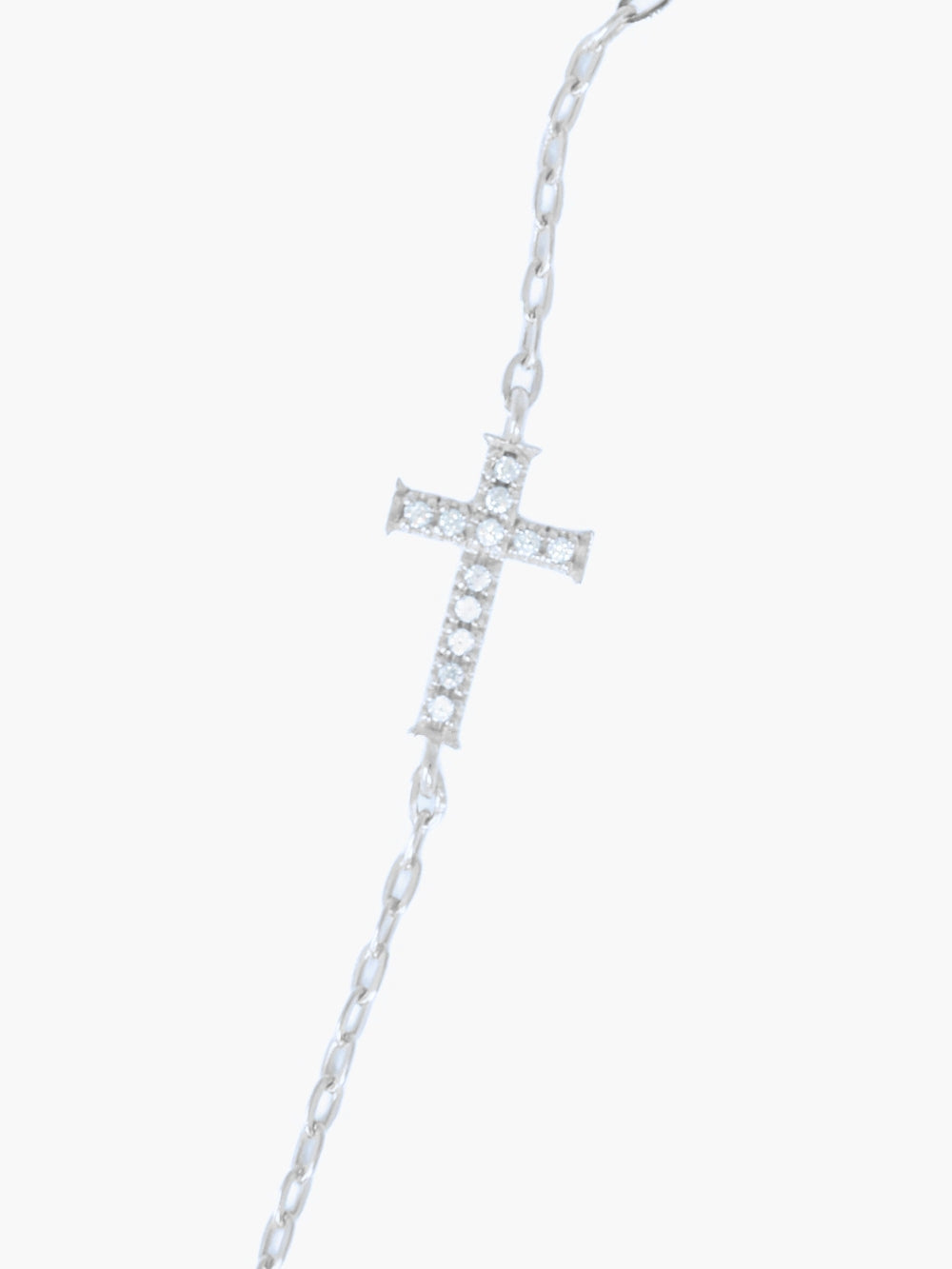 Close-up of pavé-set Rizen Cross pendant, 8mm by 12mm, on sterling silver micro paper clip link chain