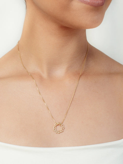 Women's Christian jewelry model is wearing the Crown of Thorns Necklace in the 18k gold plated from the Insignia collection. An Inspirational gift for any occasion by Rizen Jewelry.