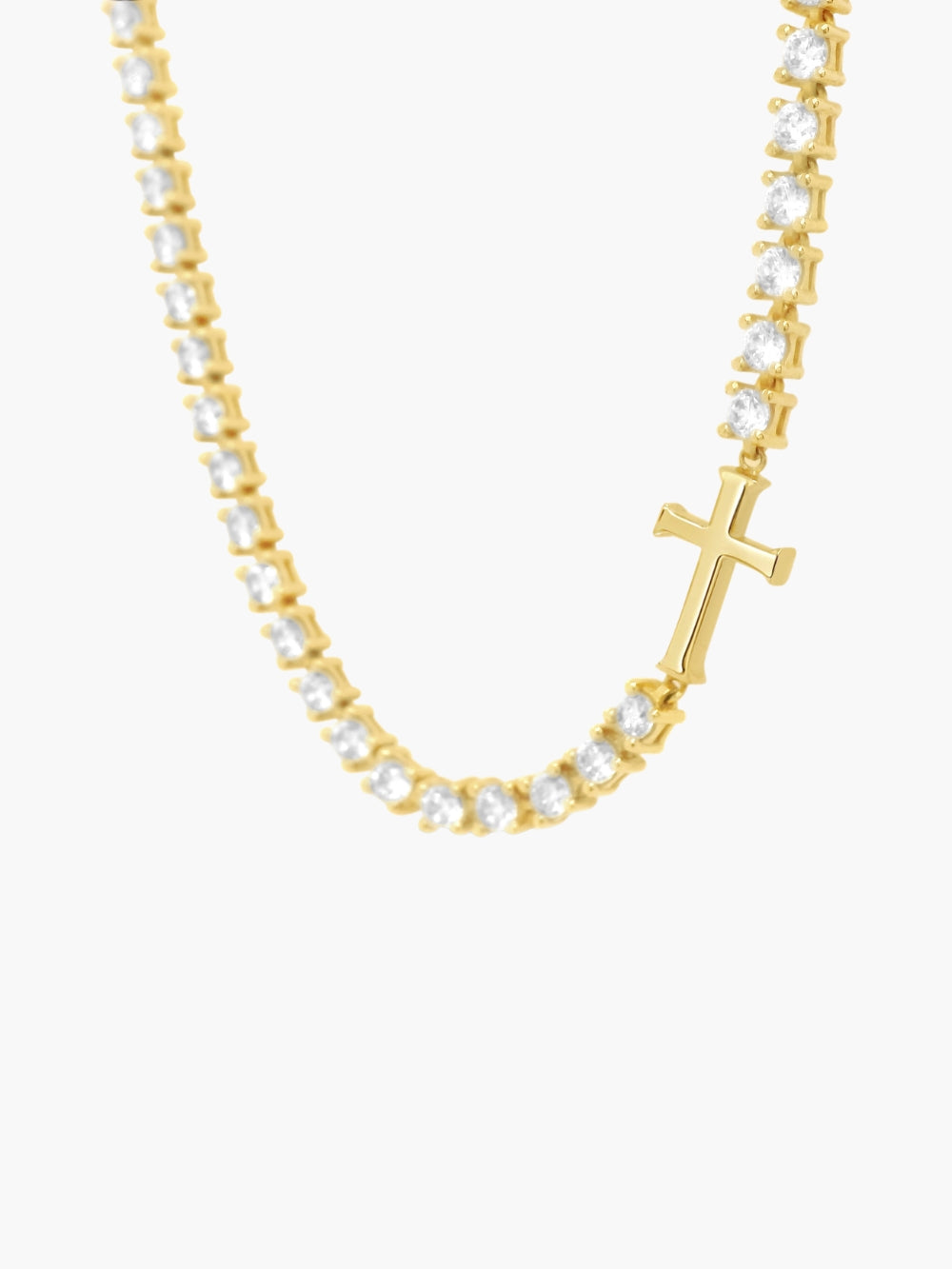 Up close look at the Luminous cross tennis necklace in 18k gold plated by Rizen Jewelry. 