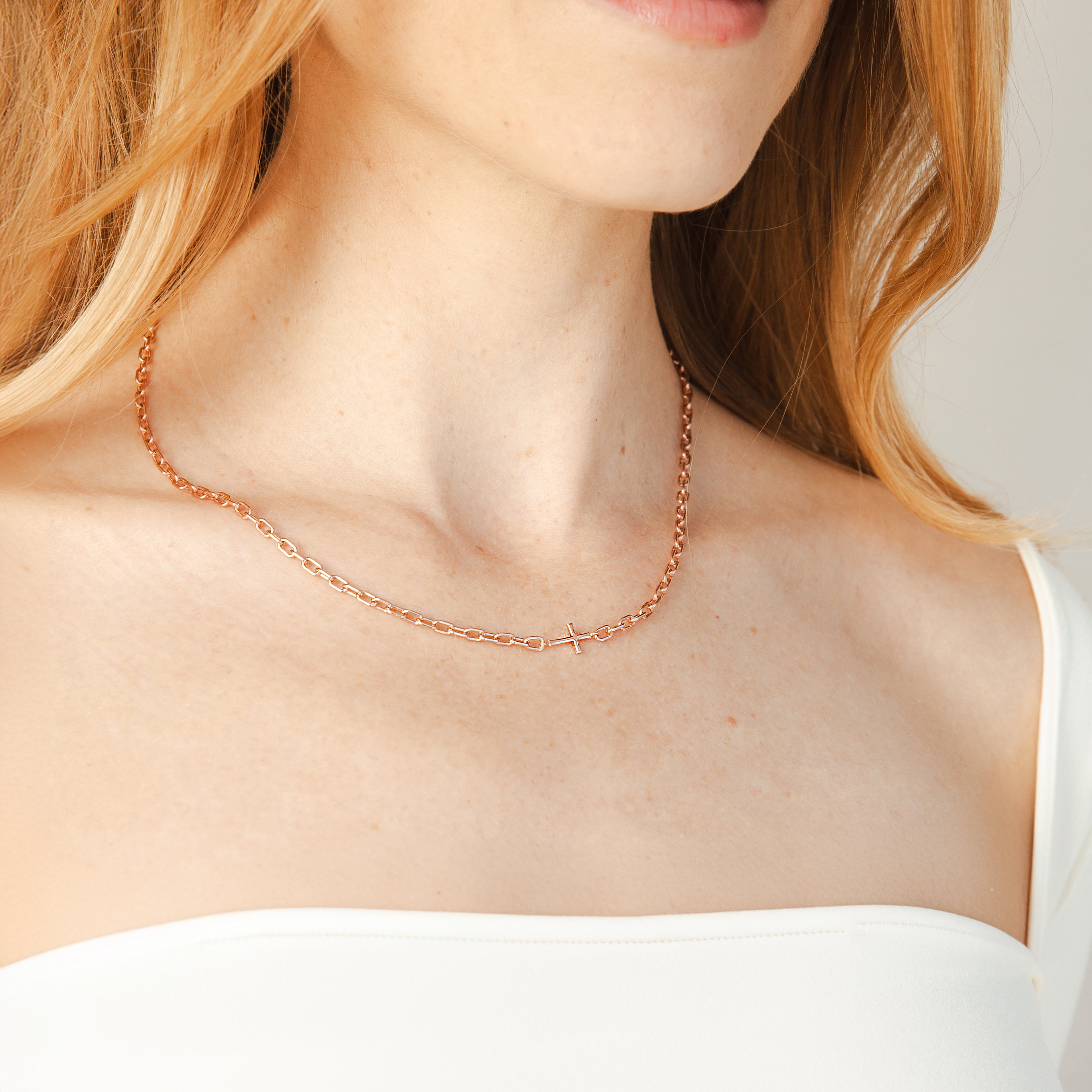 Mini Chain Breaker Cross Necklace in 18k gold vermeil from the calvary collection by Rizen Jewelry worn by Christian model. 