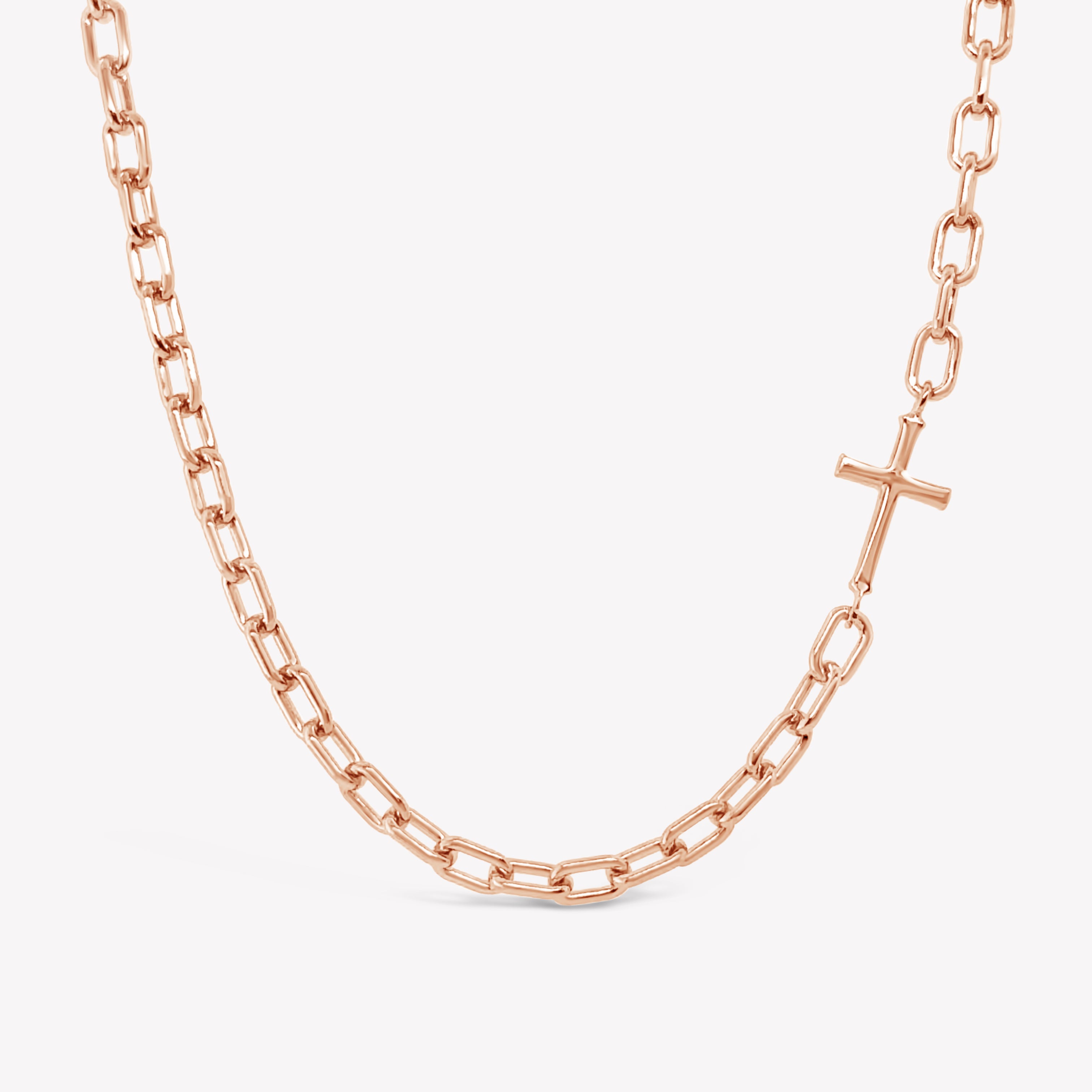Mini Chain Breaker Cross Necklace in 18k rose gold vermeil from the calvary collection by Rizen Jewelry. 