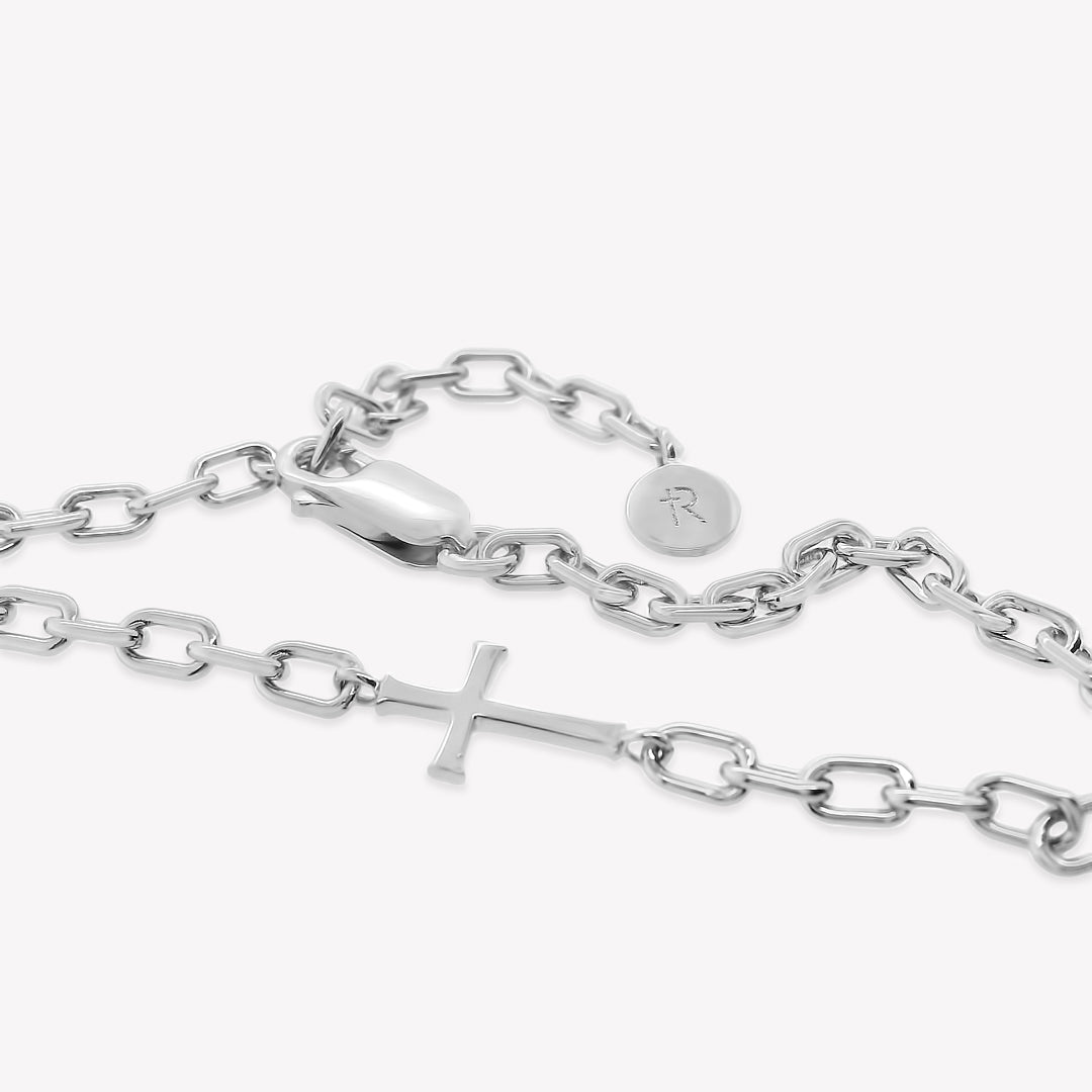 Close Up of Mini Chain Breaker Cross Necklace in sterling silver from the calvary collection by Rizen Jewelry highlighting that the lobster clasp works on every link making the necklace fully adjustable. . 