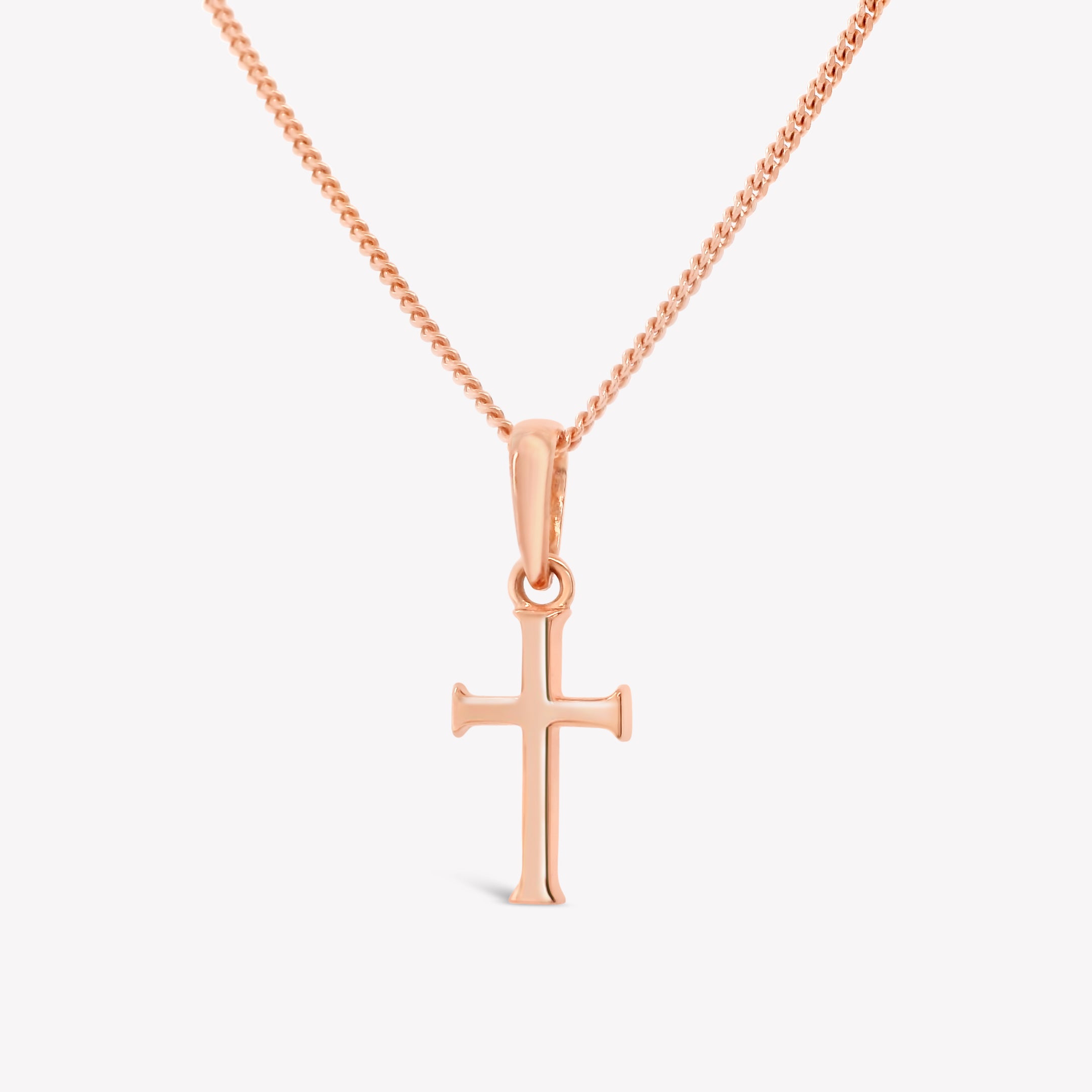 Rizen Jewelry 18k rose gold vermeil unisex cross pendant on a sleek adjustable curb chain. Perfect size for both adults and youth ages 8 years+. 