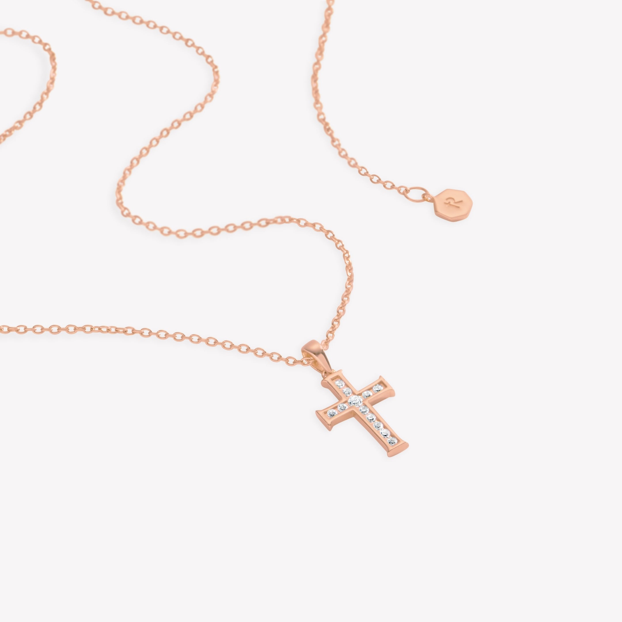 18k rose gold vermeil luminous cross pendant necklace featuring 12 sparkling cubic zirconia channel set on an adjustable 20" cable chain by Rizen Jewelry