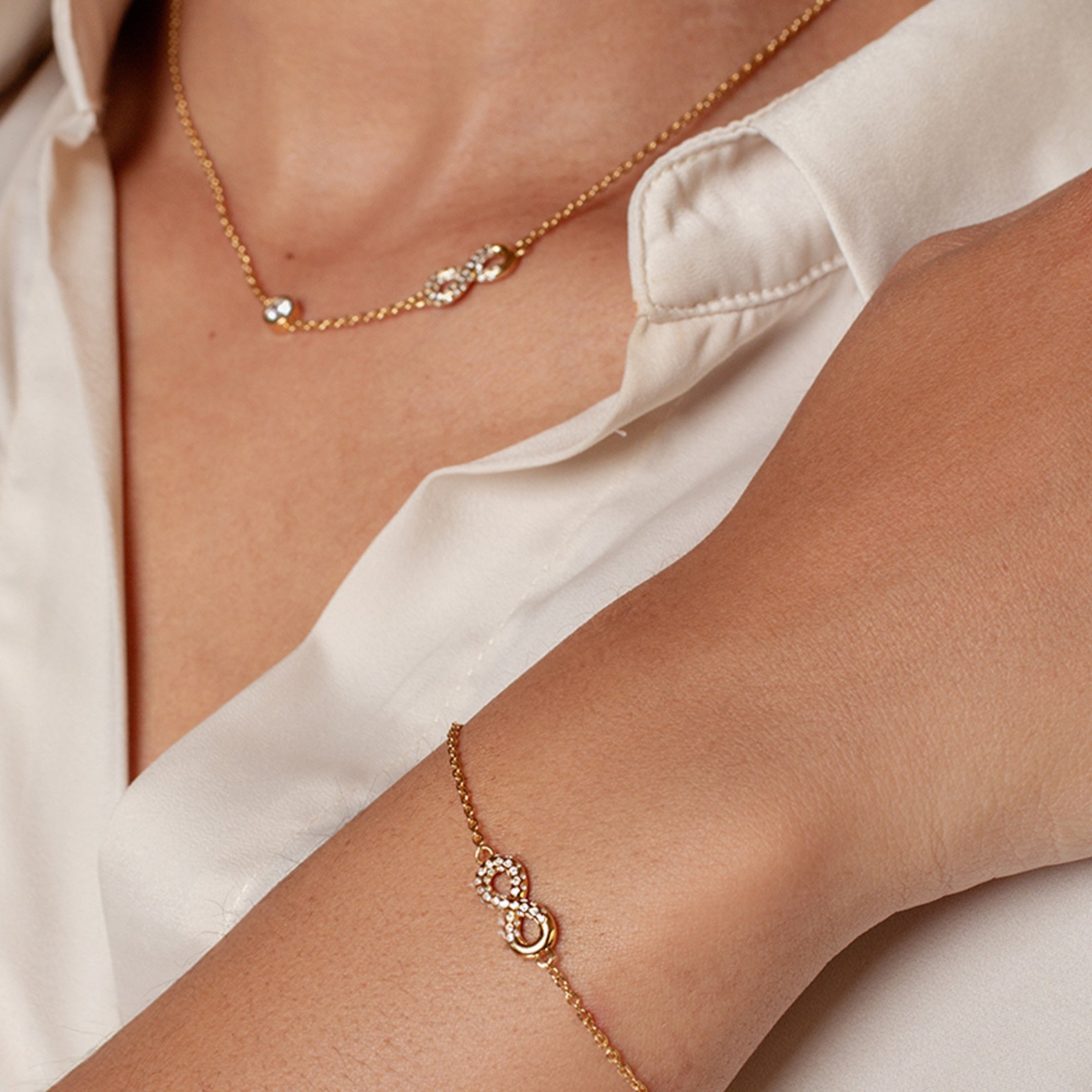 18k gold vermeil Infinite Hope Jewelry Gift Set features the matching necklace and bracelet on a Christian Woman.