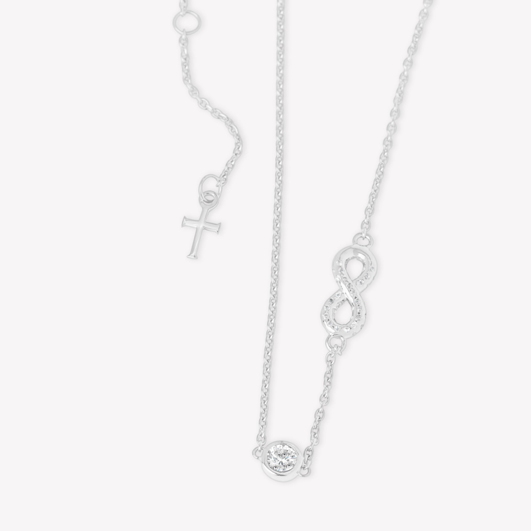 radiant sterling silver Infinite Hope necklace showcases a pavé zirconia ichthys nestled within an infinity pendant, elegantly crowned by a 5mm solitaire centerpiece designed by Rizen Jewelry. 
