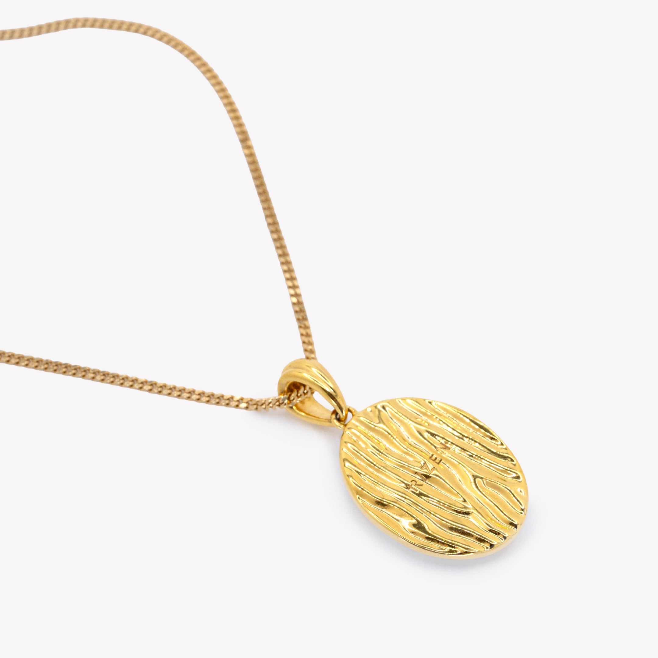 Backside of the Becoming Mother Of Pearl Cross Necklace in 100% precious metals 18k Gold Plated  over Sterling Silver from the Becoming Collection by Rizen Jewelry. showcasing the fluid water texture with the Rizen logo. 