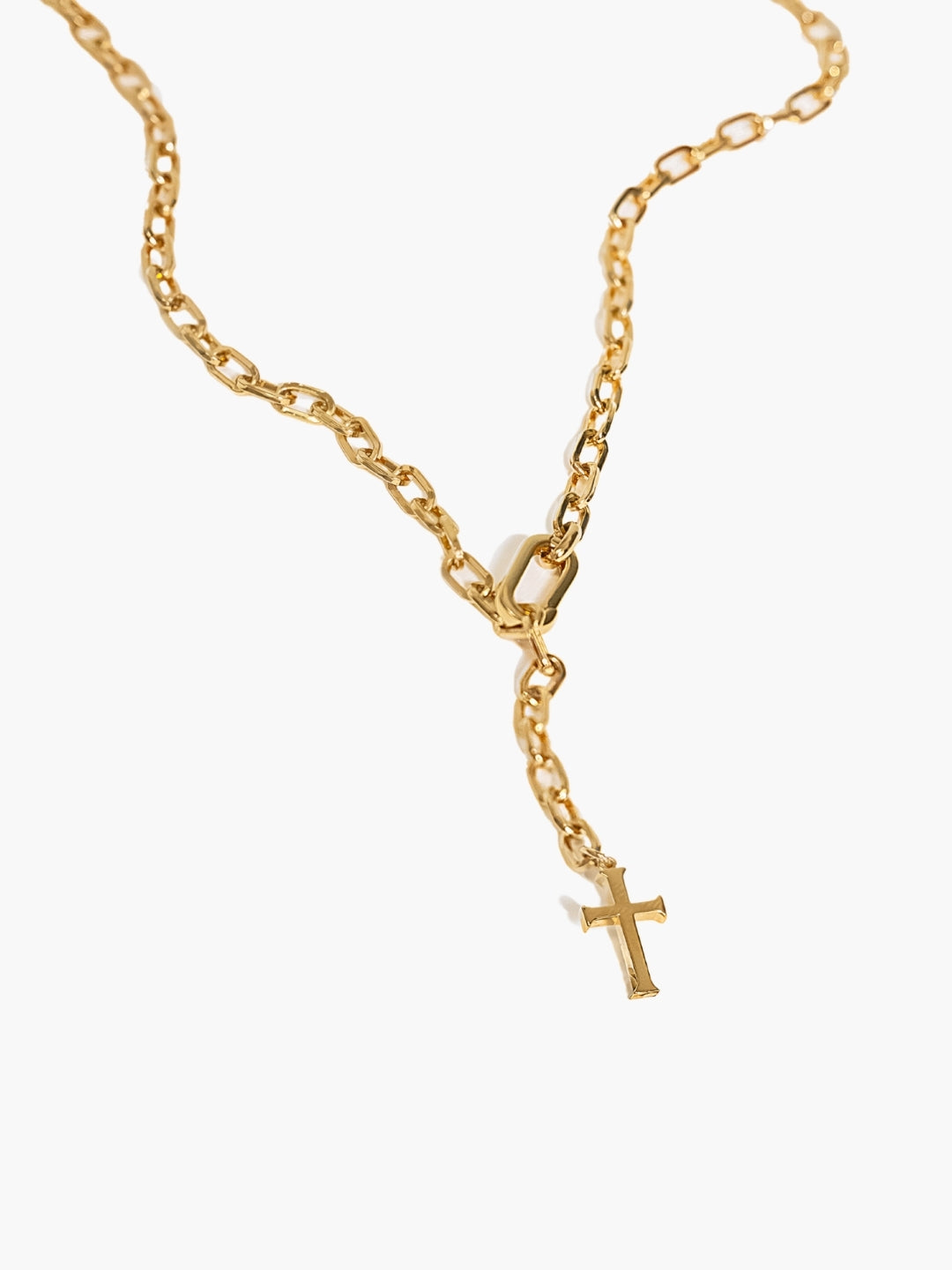 Gold versatile lariat Y-chain cross necklace. This elegant design wraps around the neck or wrist to create a sleek, refined expression of faith.