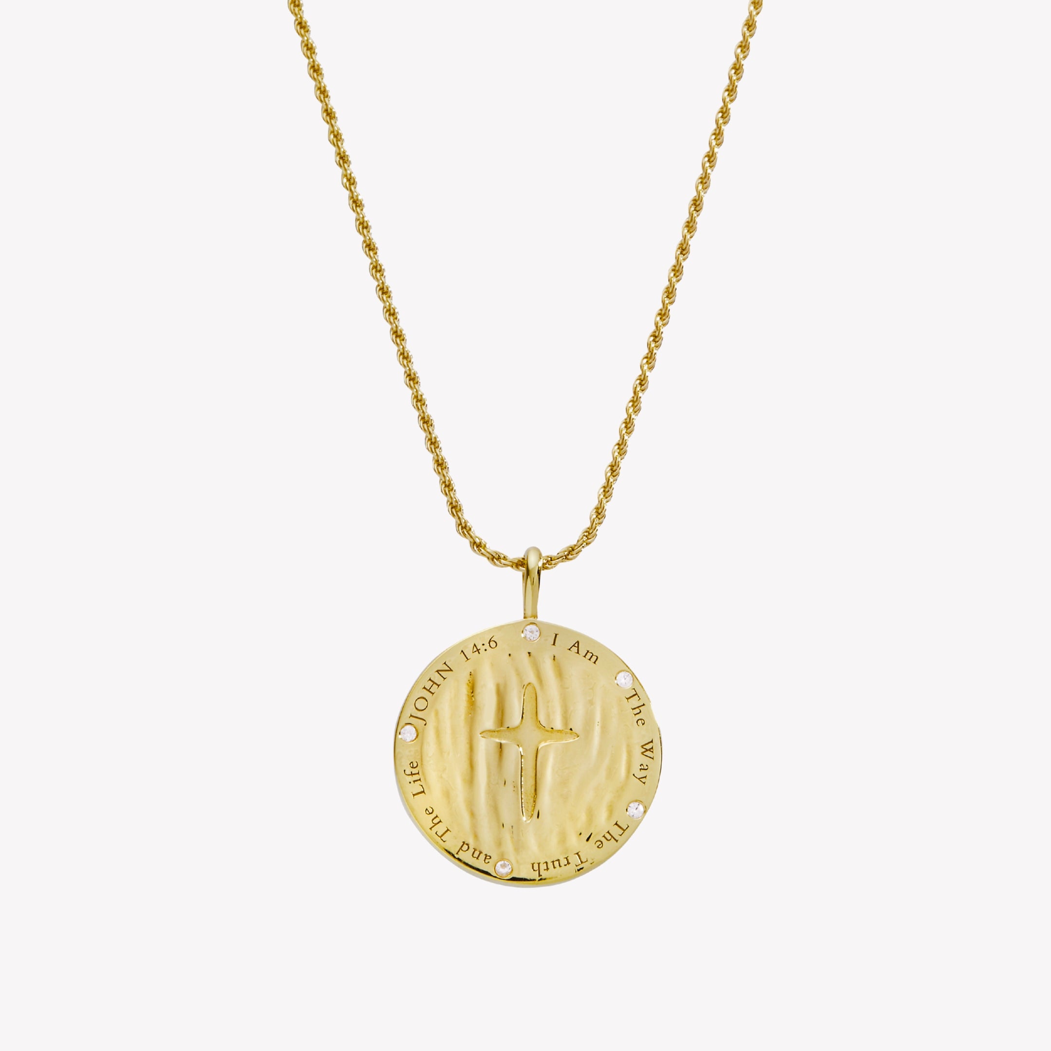 Backside of the True Direction  compass medallion necklace etched JOHN 14:6 I Am The Way The Truth and The Life, with 5cubic zirconias flush set within the border. A cross is engraved in the center. The pendant hangs from a rope chain. 