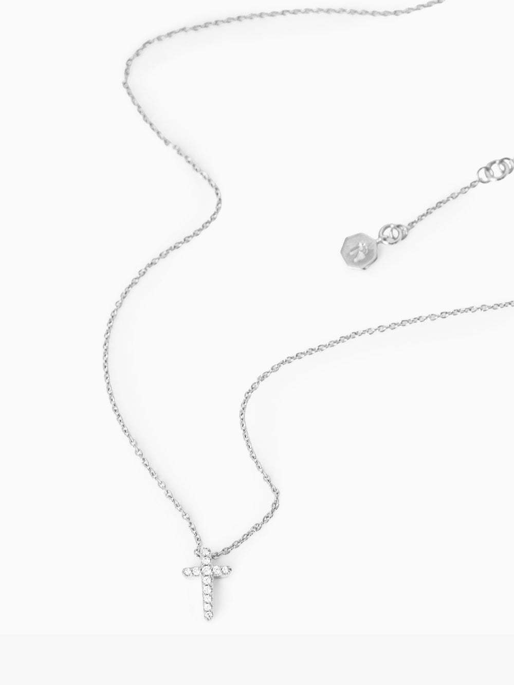 Dainty Luminous Cross Pavé Pendant Necklace in silver showing additional length settings on an 18-inch chain by Rizen Jewelry.