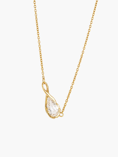 A delicate gold chain necklace featuring a teardrop-shaped simulated diamond pendant held in an infinity loop setting, designed by faith based Rizen Jewelry. Necklace is against a white backdrop.